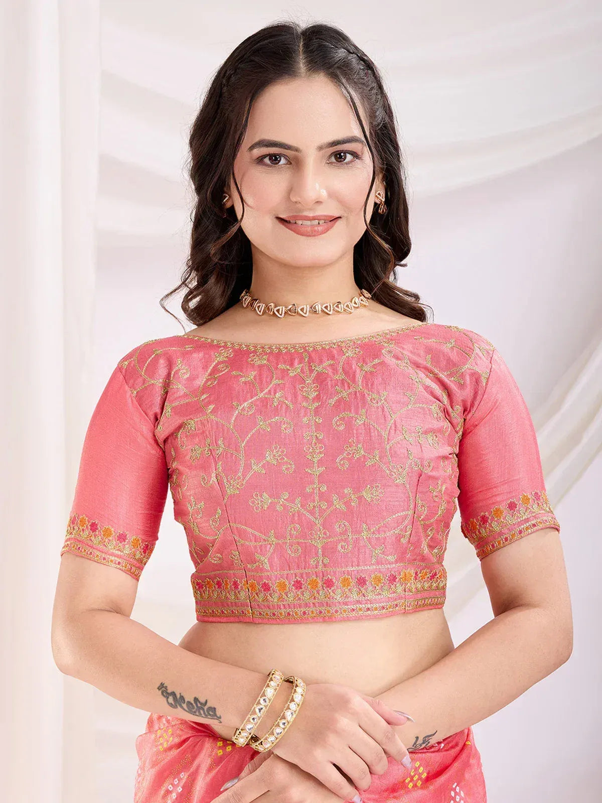 Pink embroidered blouse with gold floral work, perfect for Indian ethnic wear and saree styling