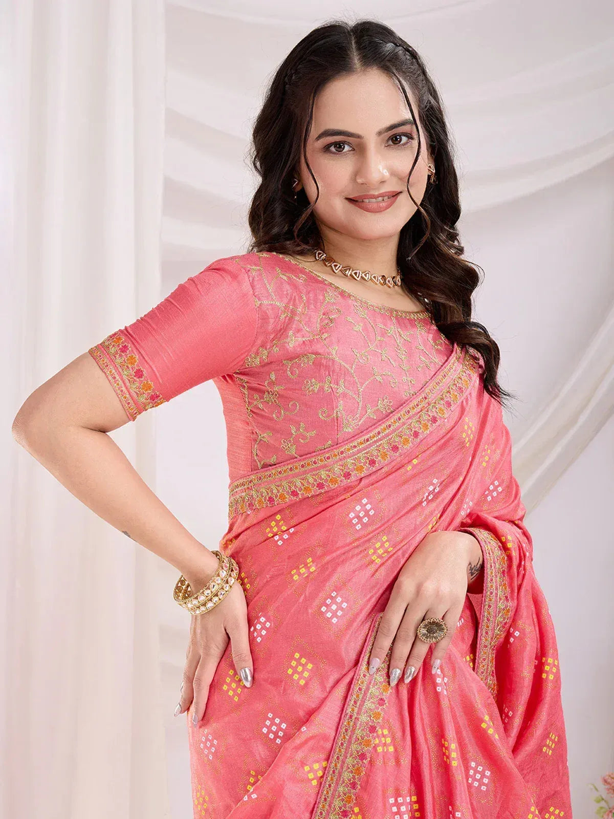 Pink embroidered saree with gold detailing, perfect for ethnic occasions and Indian celebrations