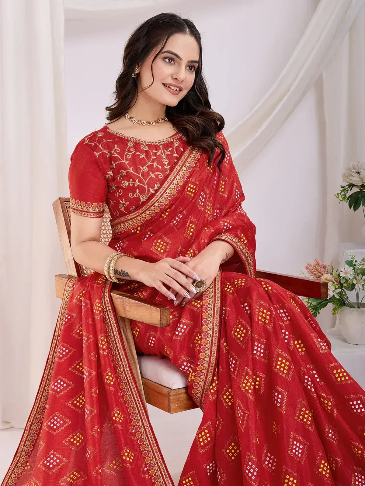 Red embroidered saree with gold motifs, perfect for Indian ethnic wear and festive occasions.