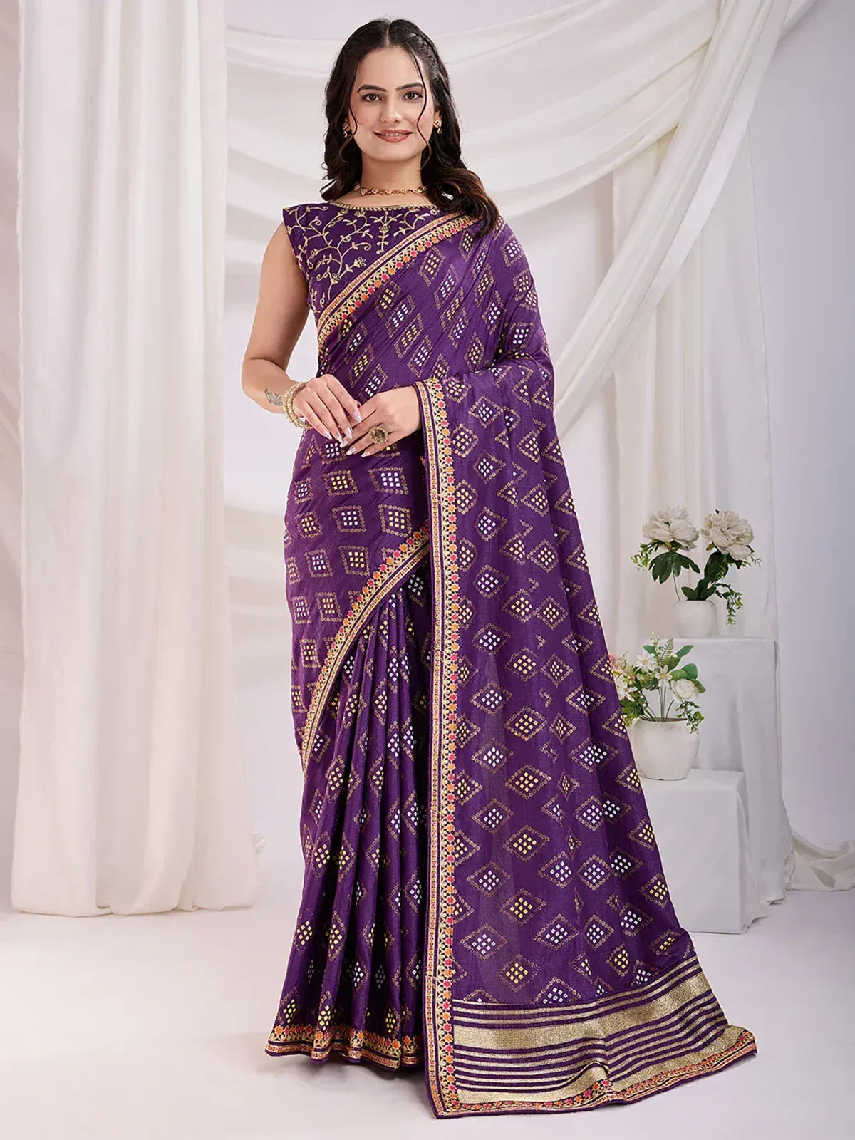 Purple ethnic saree with geometric print and gold border, perfect for Indian occasions