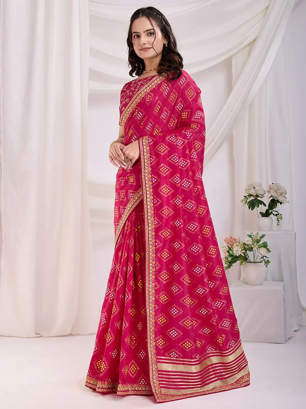 Pink ethnic saree with gold diamond print and border, styled for Indian occasions