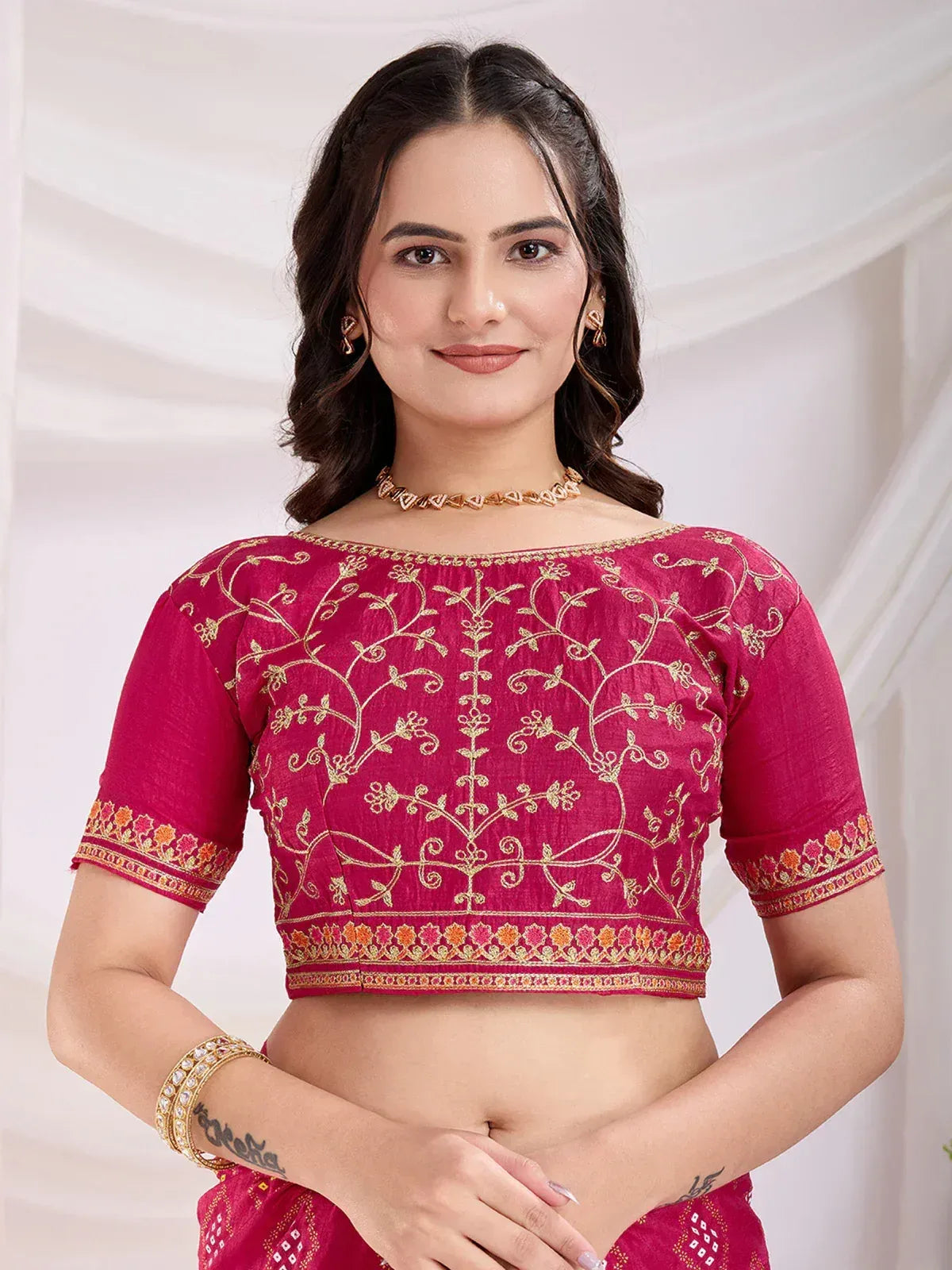 Pink embroidered blouse with gold floral work, perfect for Indian ethnic wear and saree styling
