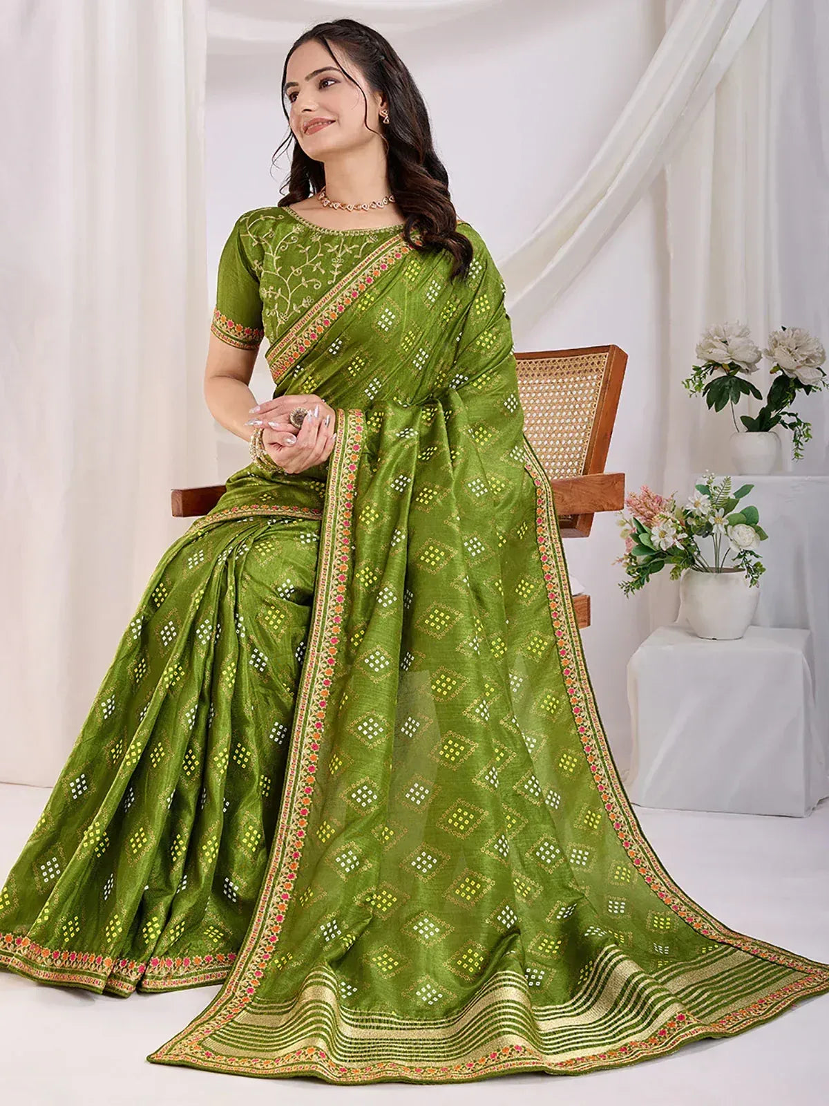 Green embroidered saree with floral border, perfect for Indian ethnic wear occasions