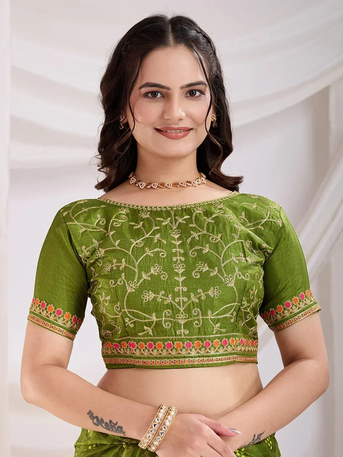 Green embroidered blouse with floral gold work, perfect for Indian ethnic wear and saree styling