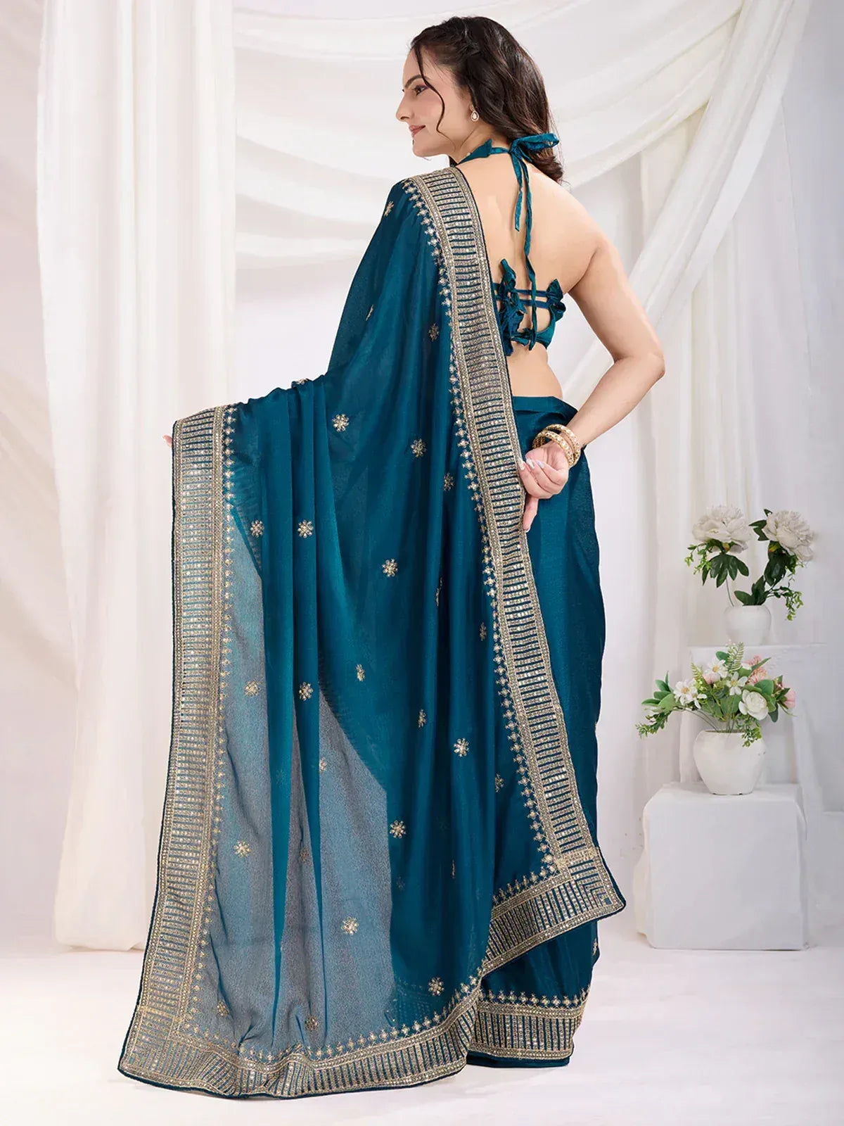 Teal designer saree with gold embroidery and halter neck blouse, ethnic Indian wear