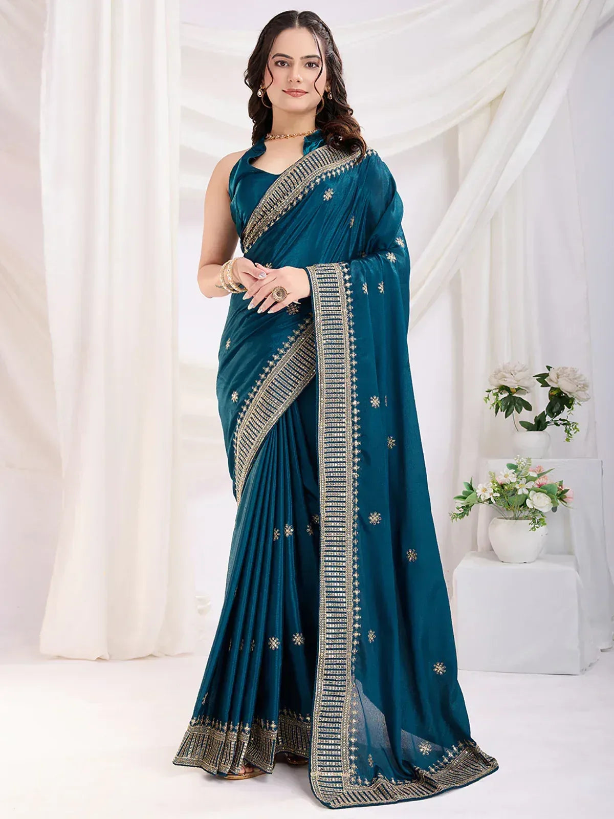 Teal designer saree with gold embroidery, perfect for Indian ethnic wear occasions