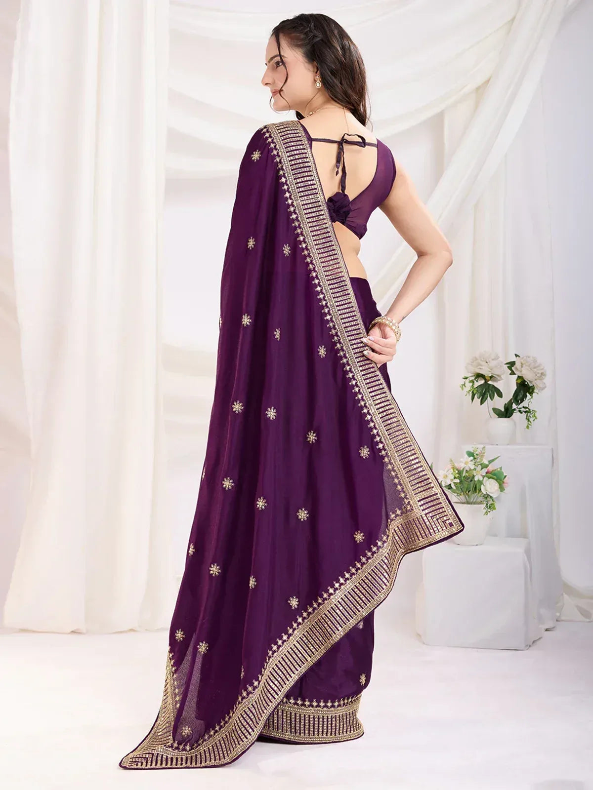 Purple ethnic saree with gold embroidery and backless blouse, perfect for Indian occasions
