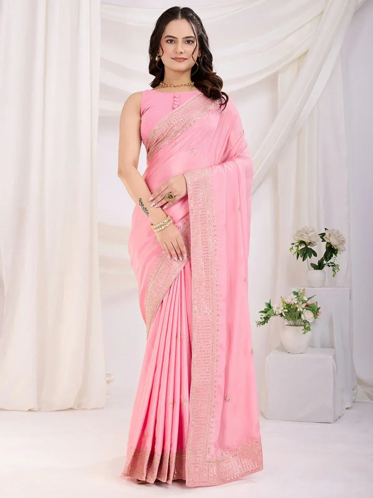 Pink embroidered saree with gold detailing, perfect for Indian ethnic wear occasions