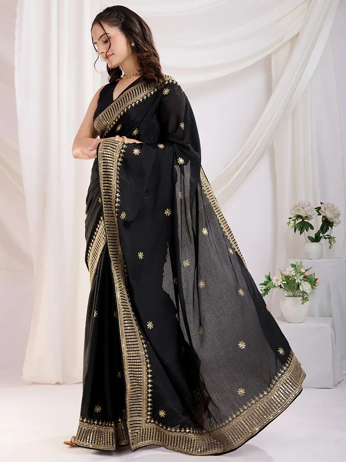 Black saree with gold embroidery and border, elegant Indian ethnic wear for women