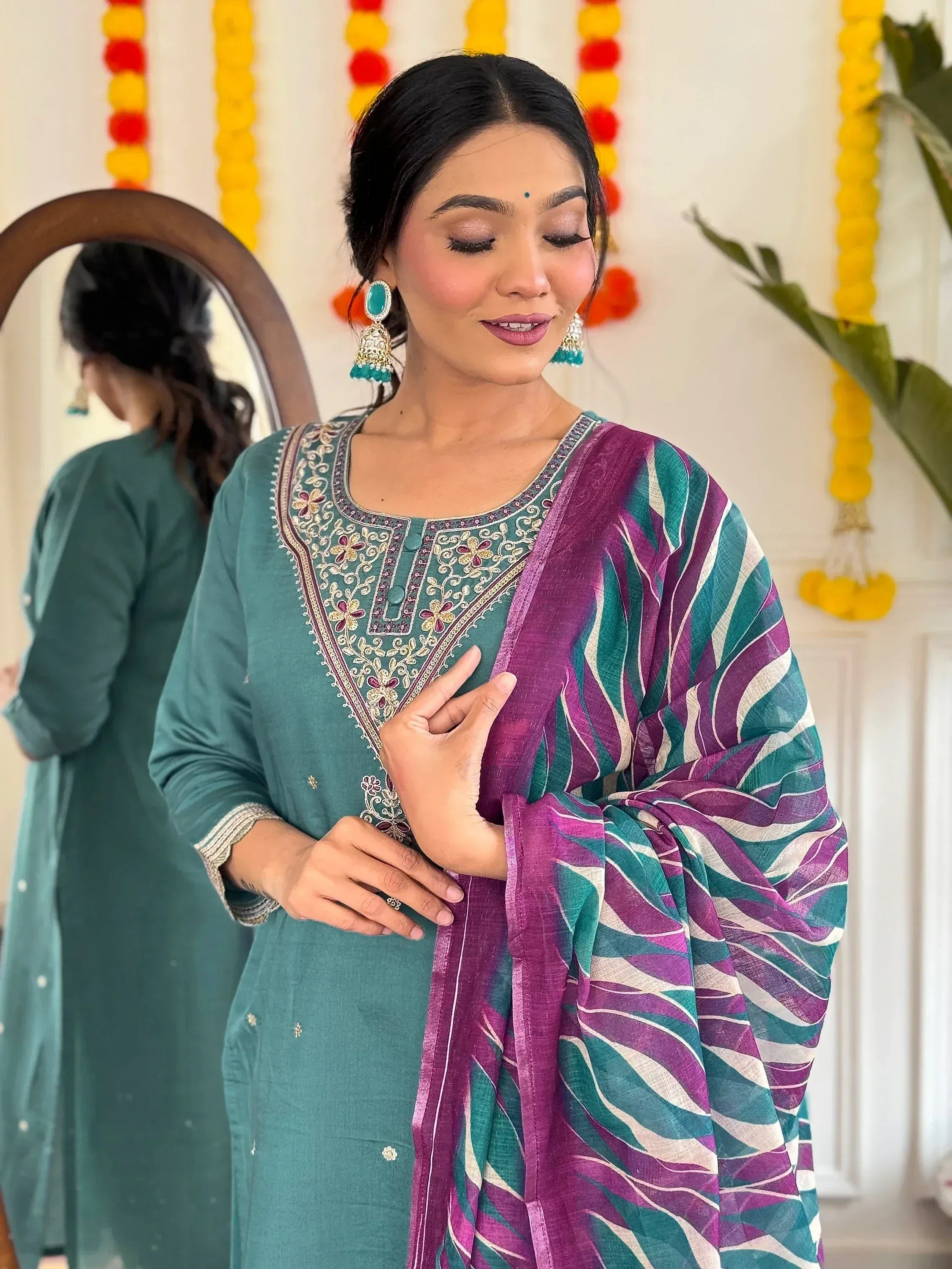 Woman in teal embroidered kurta with purple-green striped dupatta, festive Indian ethnic wear