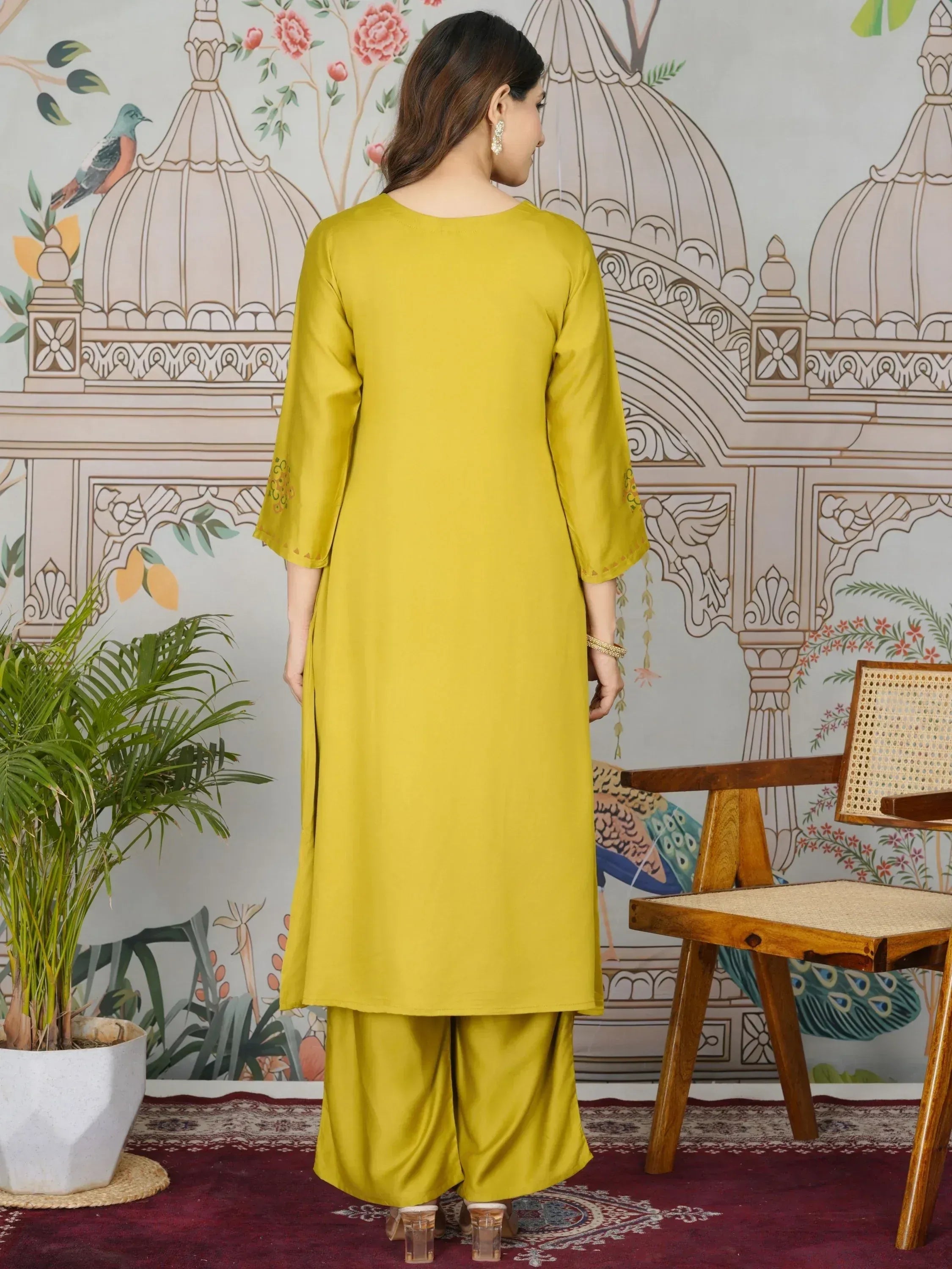 Yellow ethnic kurta with palazzo pants, back view, floral dome backdrop