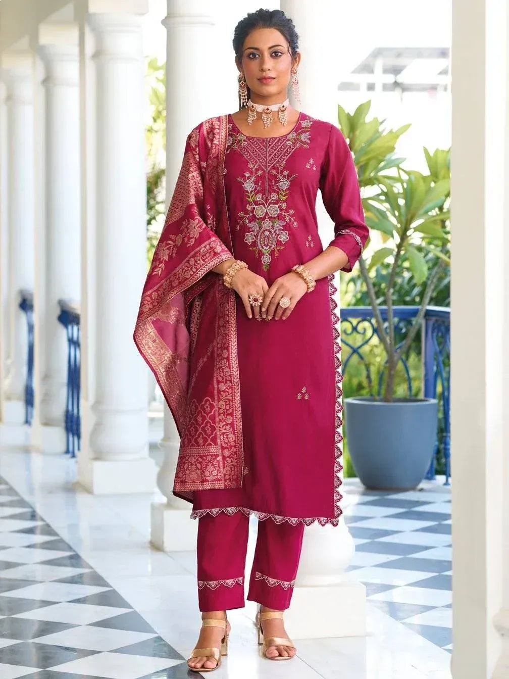 Maroon embroidered salwar kameez with gold detailing, perfect for ethnic occasions and festive wear