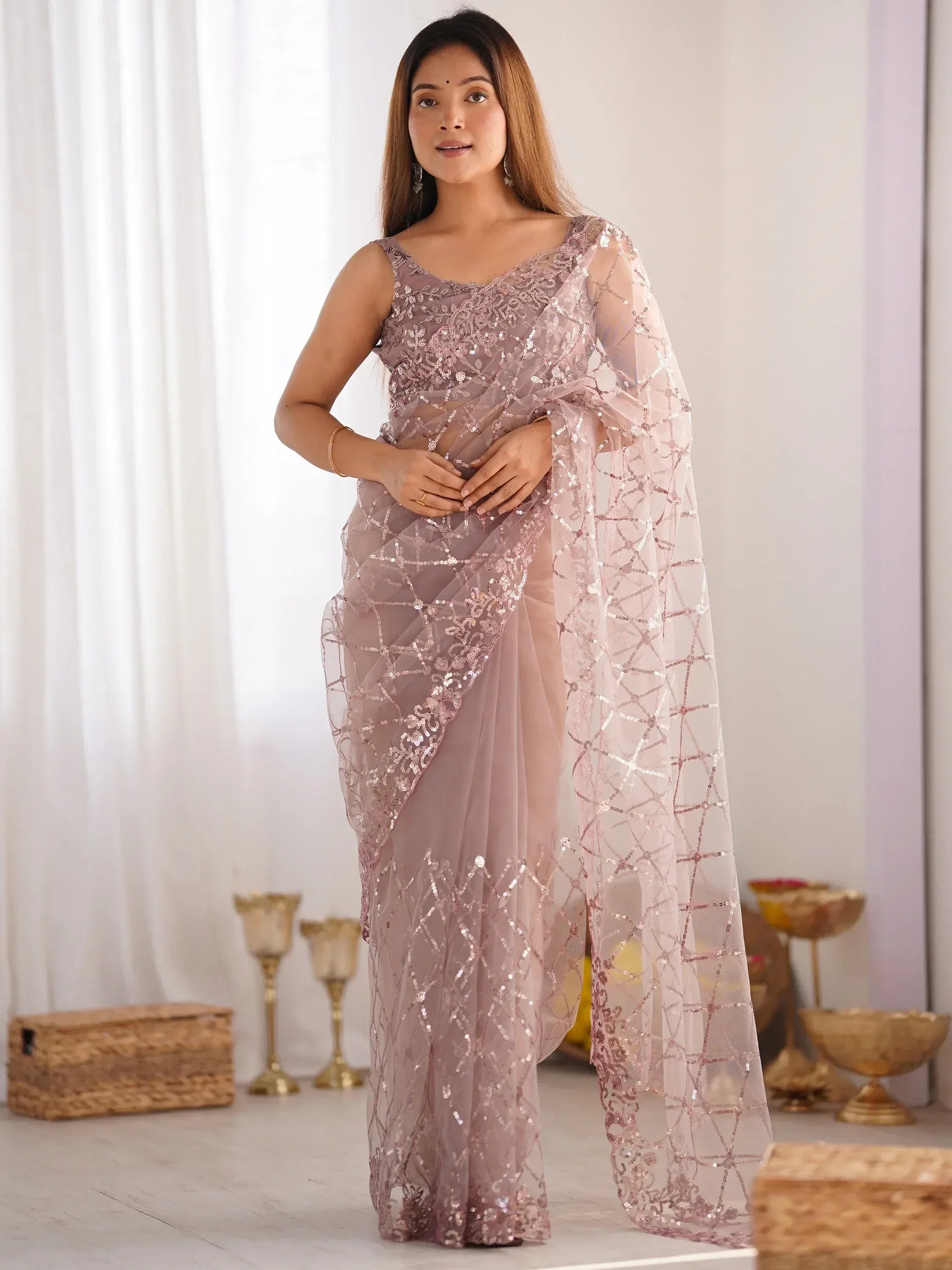 Elegant mauve sequin saree with sheer overlay, perfect for Indian ethnic occasions and festive wear.