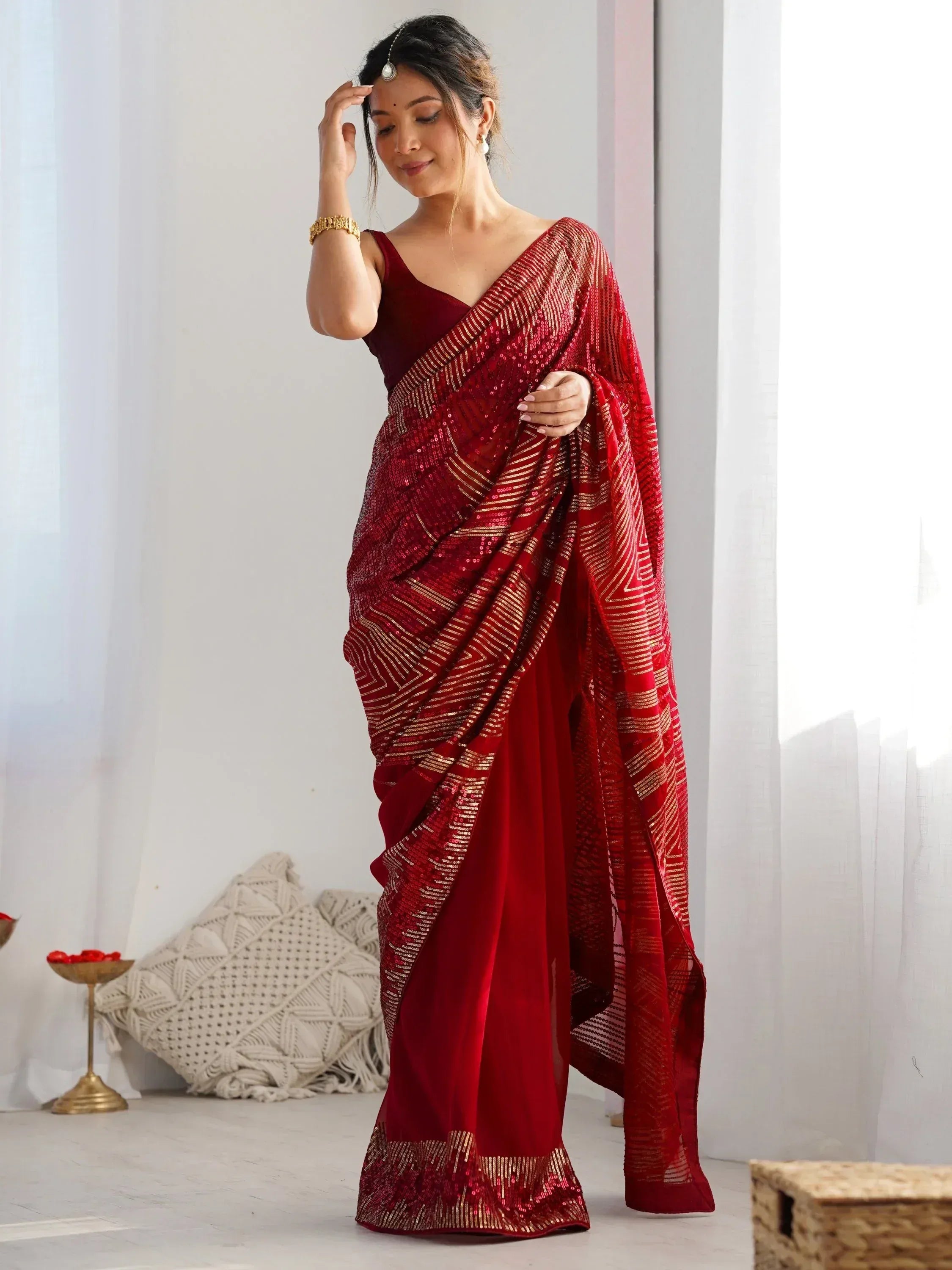 Red sequin saree with gold stripes, ethnic Indian wear for festive occasions