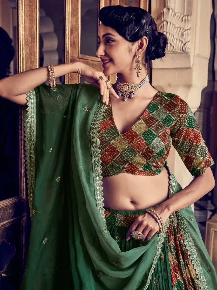 Green and red patterned lehenga choli with embroidery, traditional Indian ethnic wear for women