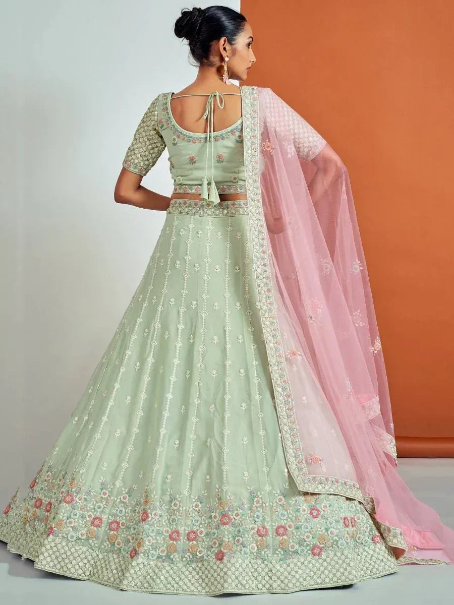 Mint green embroidered lehenga choli with pink dupatta, perfect for Indian ethnic wear occasions