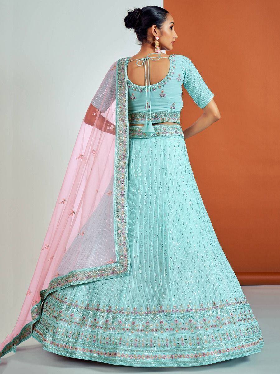 Mint green embroidered lehenga choli with pink dupatta, perfect for Indian ethnic wear occasions