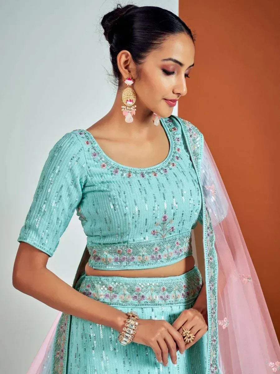 Mint green sequin lehenga choli with floral embroidery and pink dupatta, perfect for Indian ethnic occasions