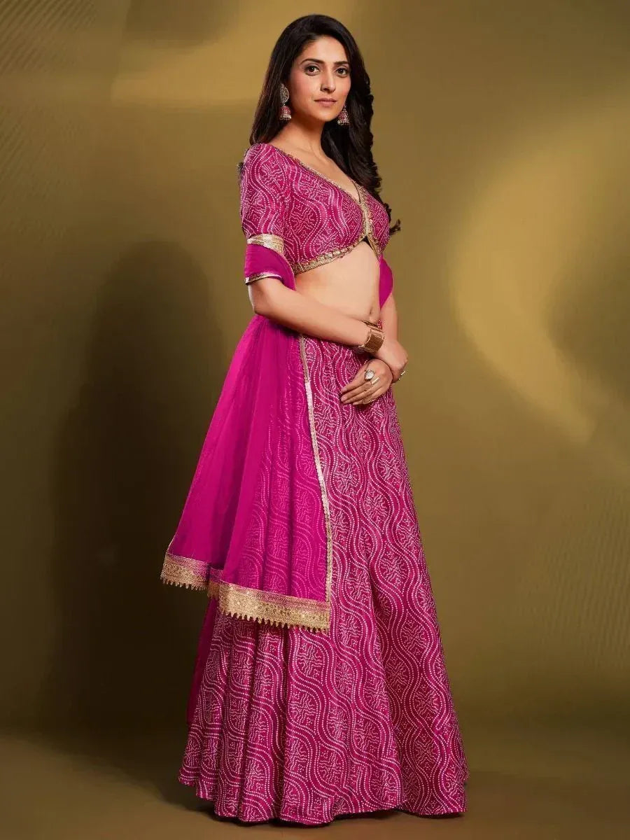 Pink designer lehenga choli with gold embroidery, perfect for Indian ethnic wear occasions