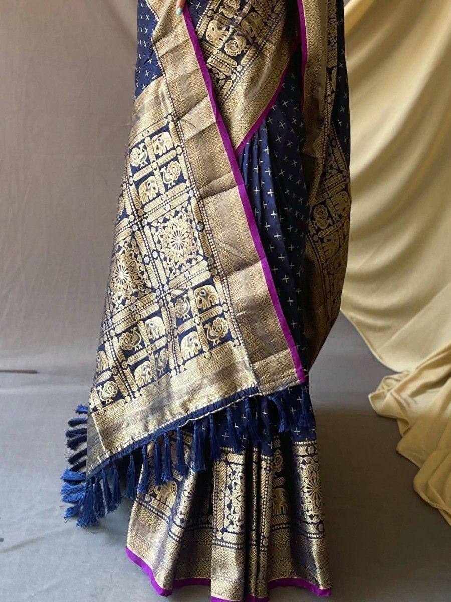 Navy blue and gold designer saree with elephant motifs and purple border, ethnic Indian wear
