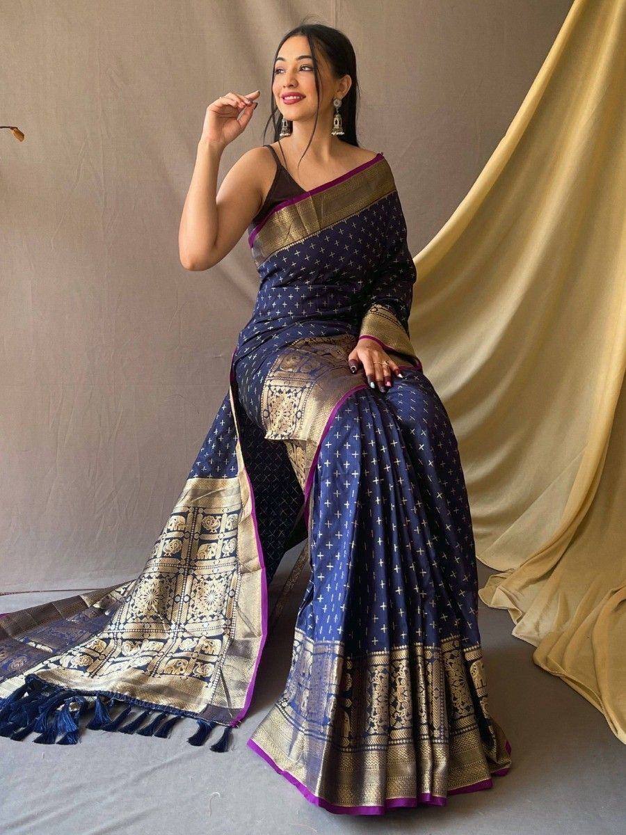 Navy blue designer saree with gold elephant motifs and purple border, styled with matching blouse for ethnic wear