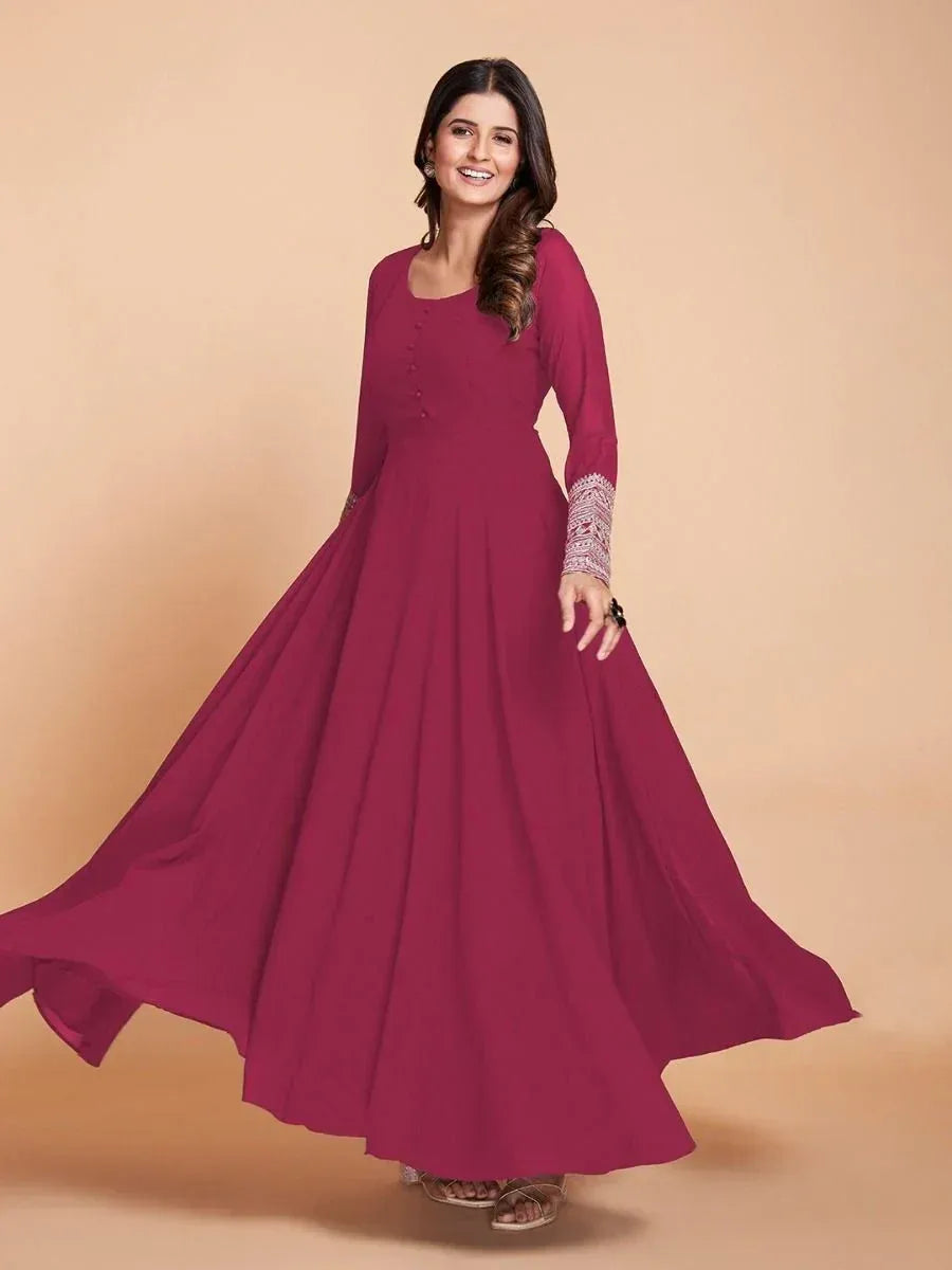 Burgundy ethnic gown with embroidered sleeves, flowing skirt, perfect for Indian occasions