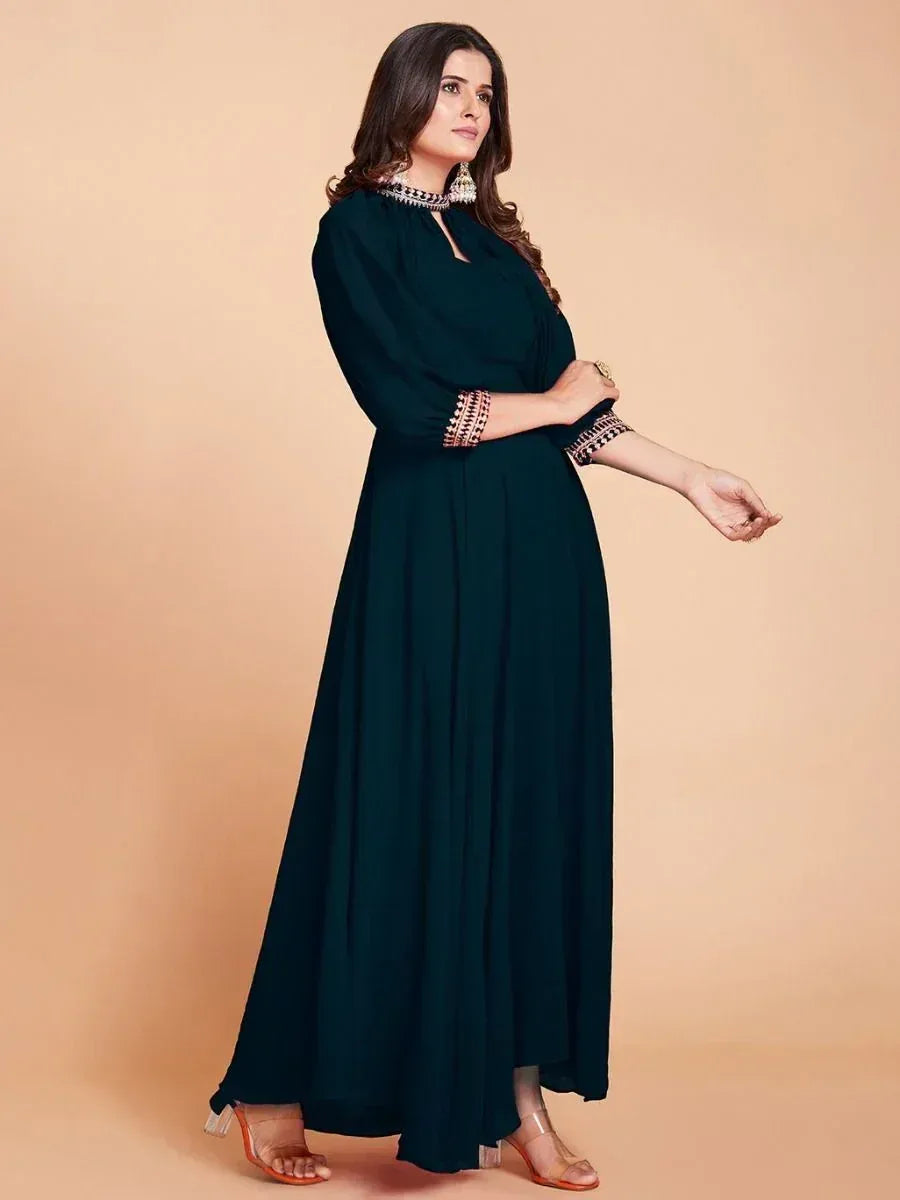 Elegant dark green ethnic gown with embroidered neckline and sleeves, perfect for Indian occasions