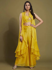 Woman in yellow designer ethnic palazzo set with floral crop top from Ethnic Plus