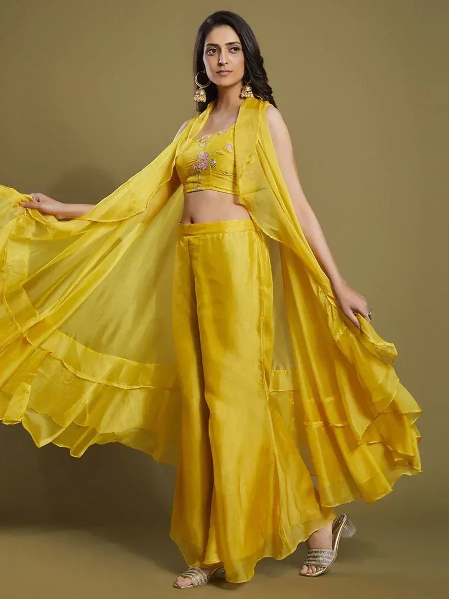 Woman in yellow embroidered ethnic crop top with palazzo pants and dupatta