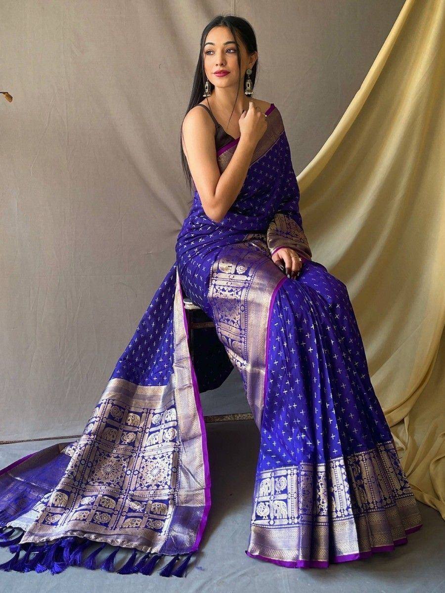 Purple designer saree with elephant motifs and gold border, perfect for ethnic occasions