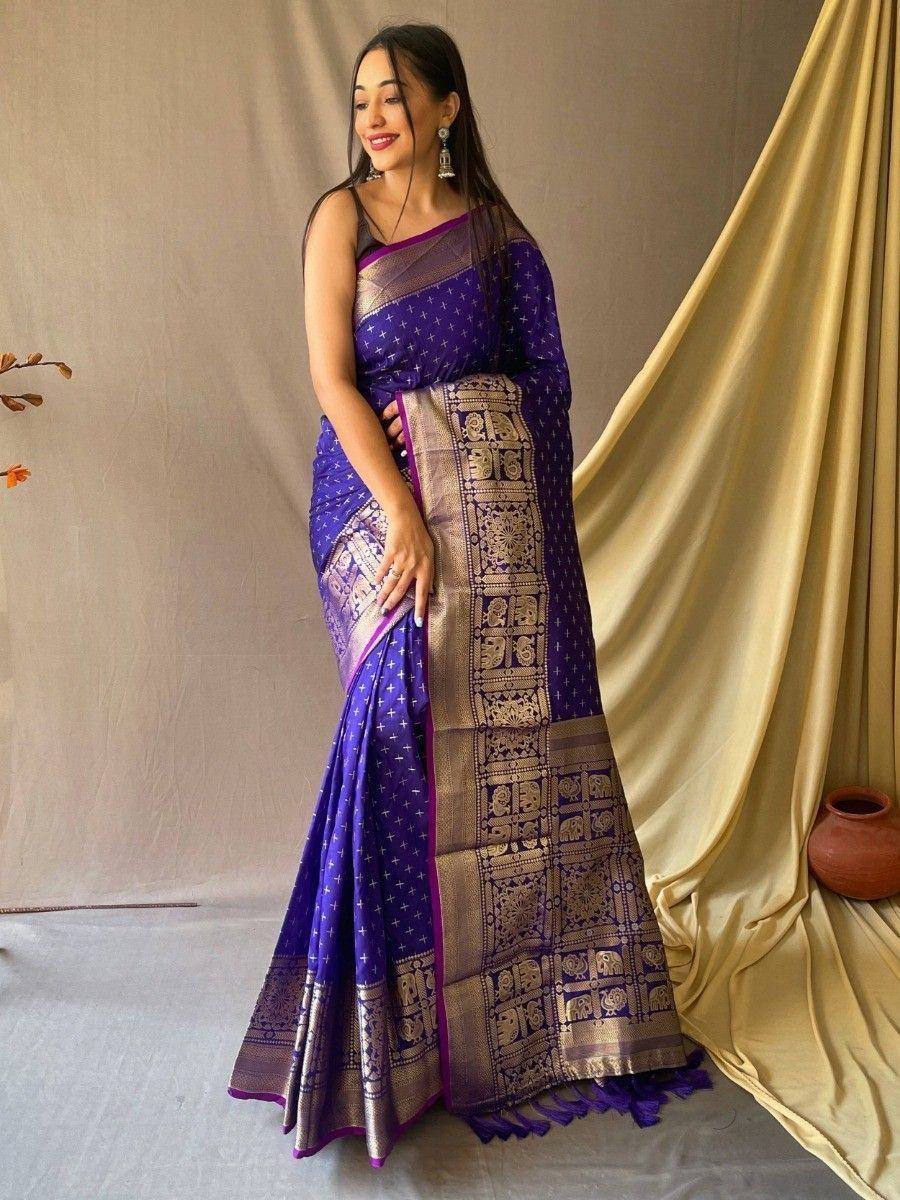 Purple designer saree with gold elephant motifs and temple border, ethnic wear for women