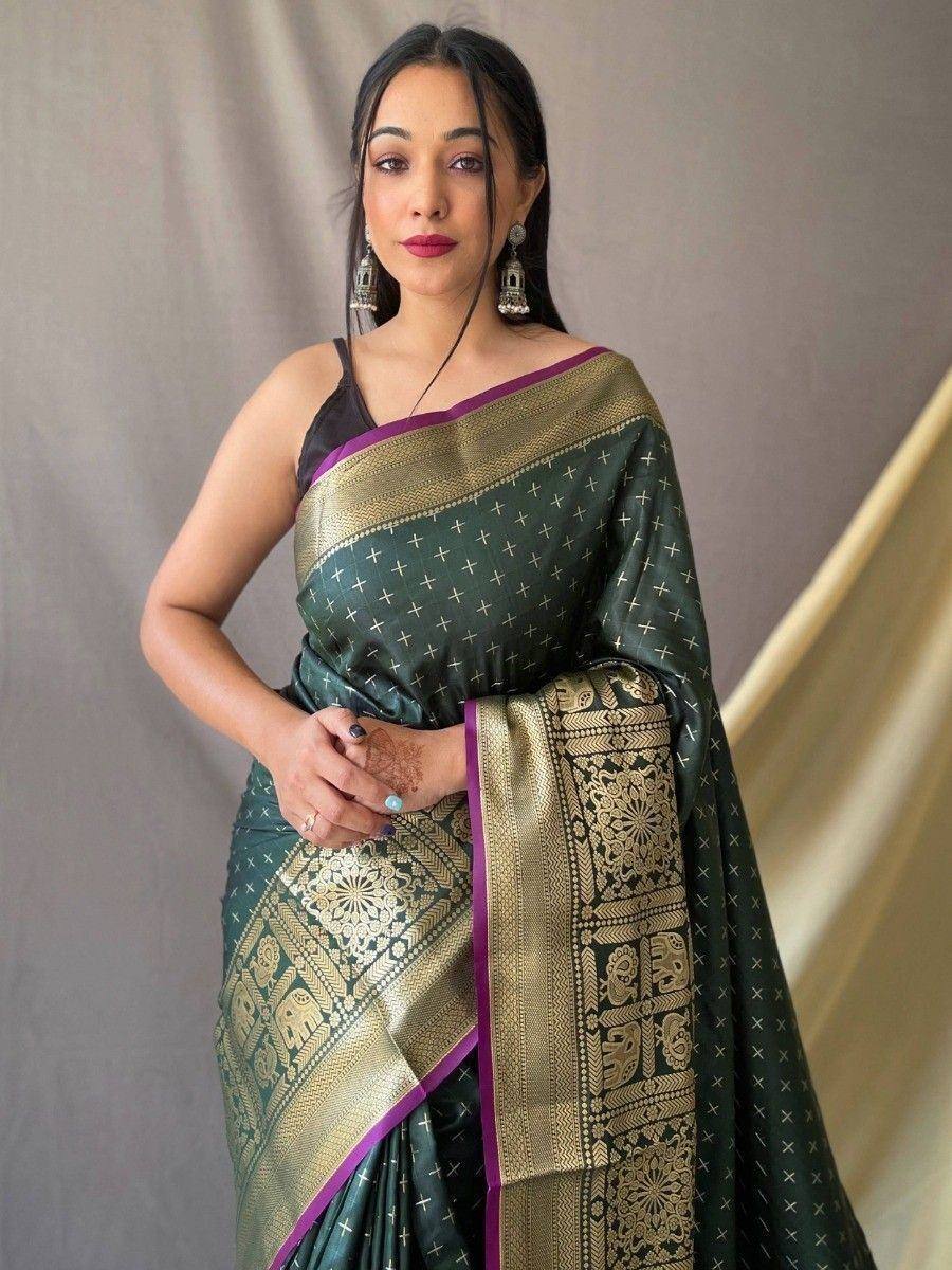 Elegant green saree with gold zari work and purple border, paired with black blouse for ethnic wear