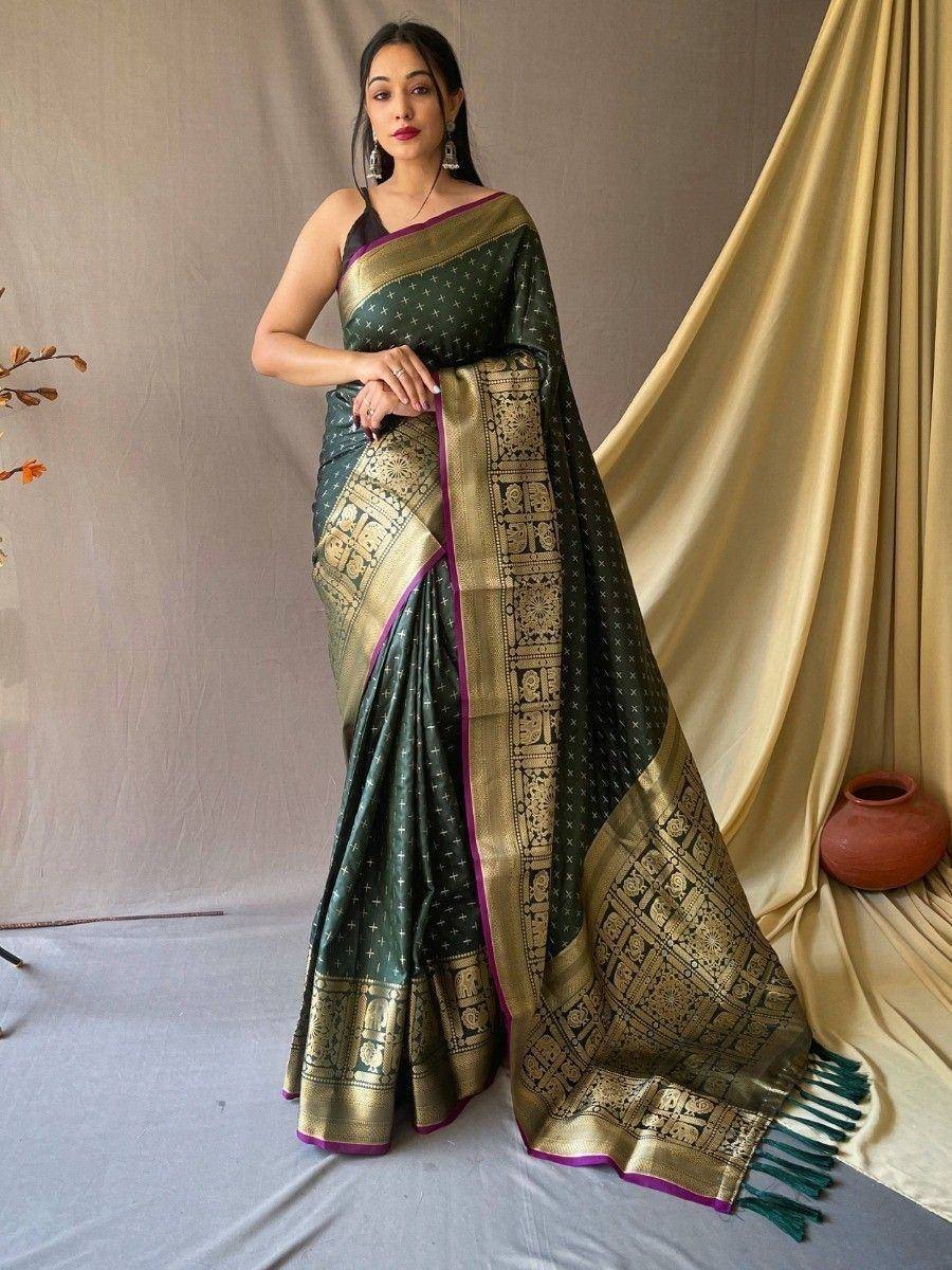 Elegant green and gold designer saree with intricate border, perfect for ethnic occasions