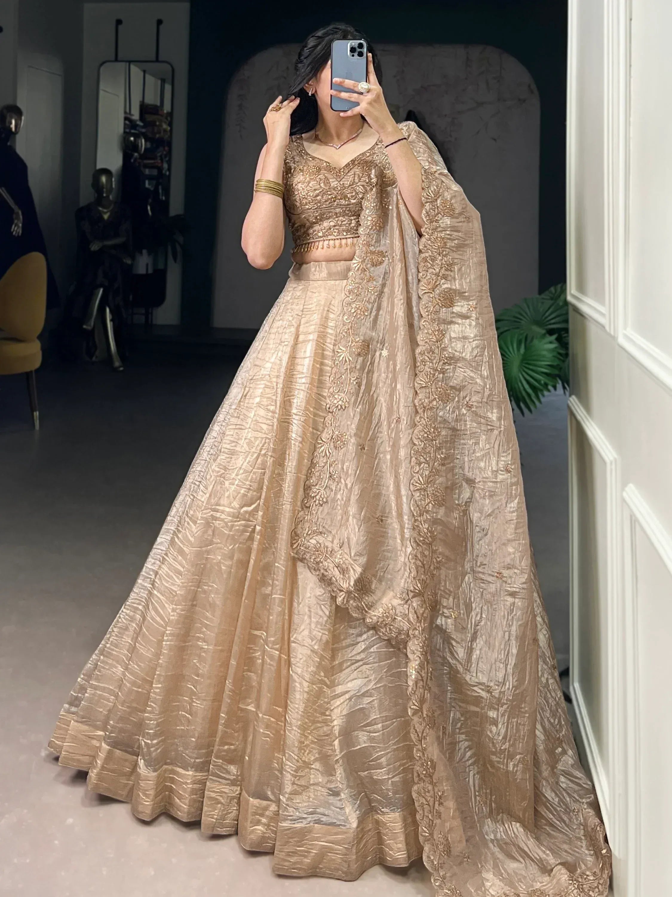 Elegant gold embroidered lehenga choli with dupatta, perfect for Indian weddings and festive occasions