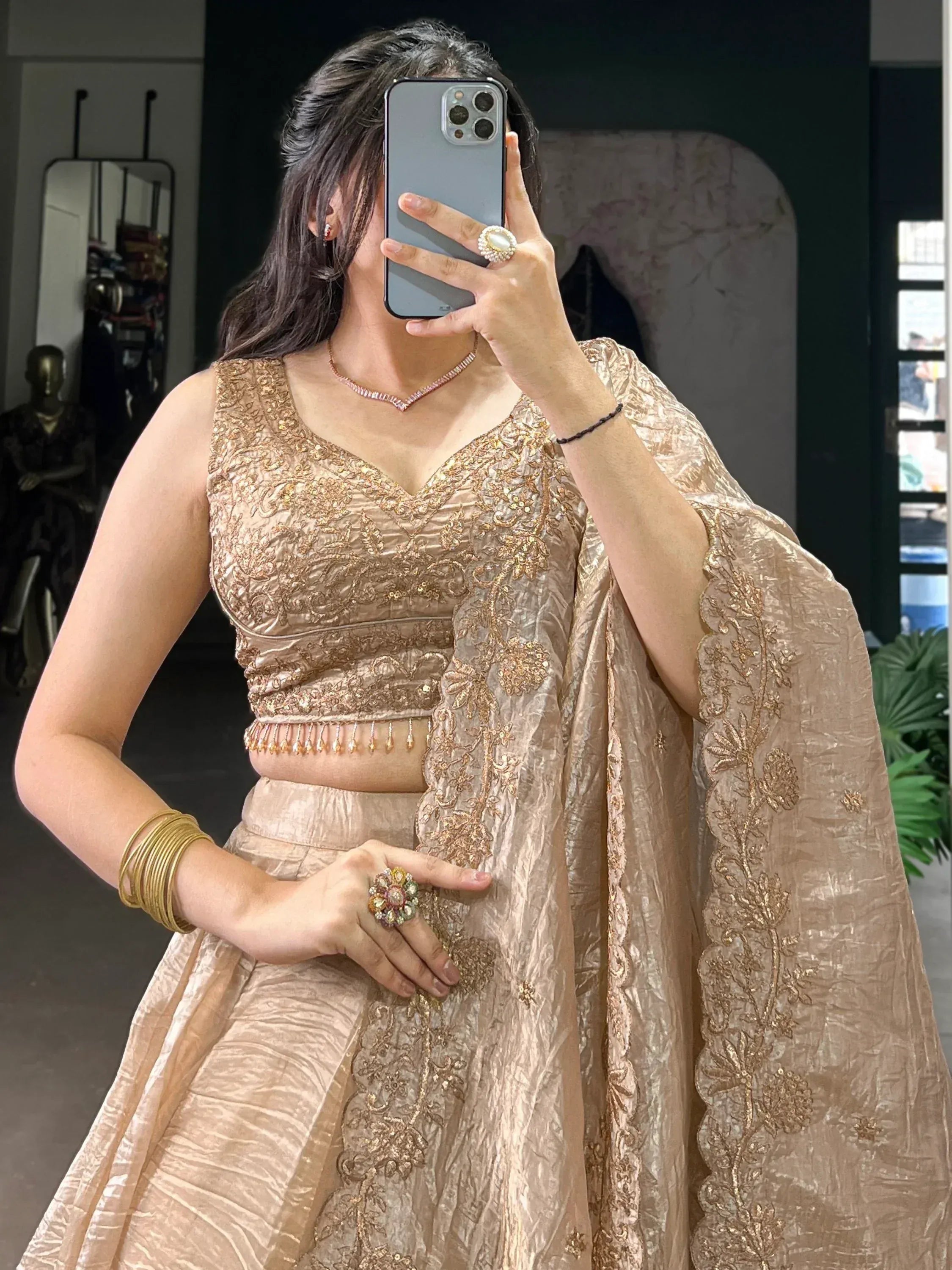 Elegant gold embroidered lehenga choli with matching dupatta, perfect for Indian ethnic occasions