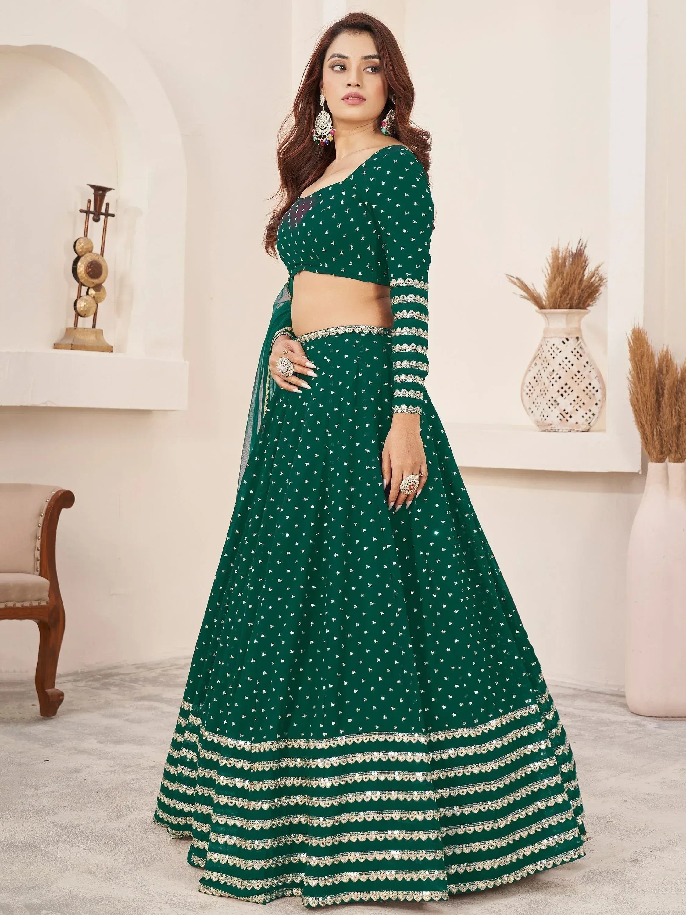 Emerald green designer lehenga choli with silver embroidery, perfect for Indian ethnic wear and festive occasions.