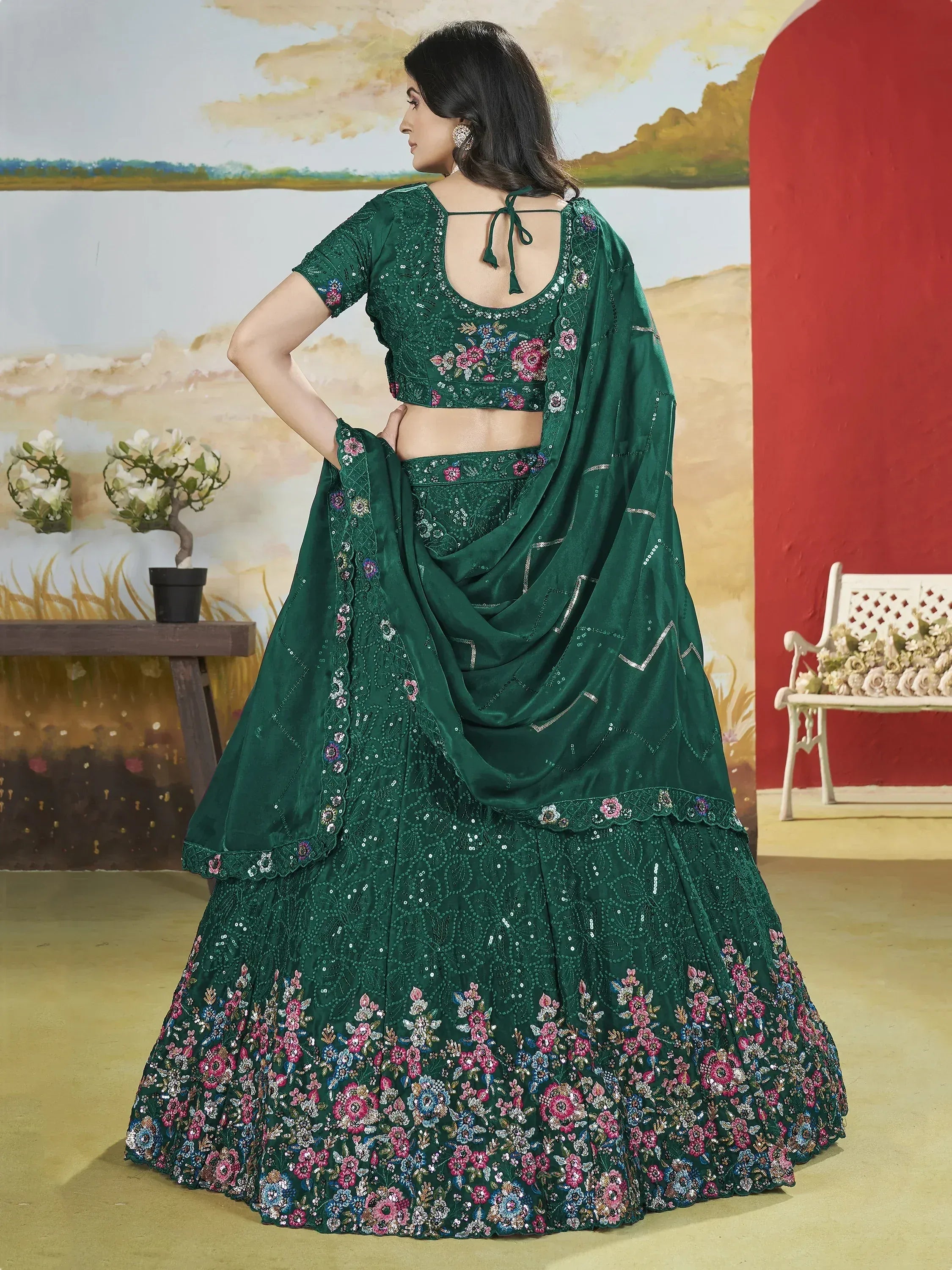 Emerald green embroidered lehenga choli with floral motifs and sequin work, perfect for Indian ethnic occasions.