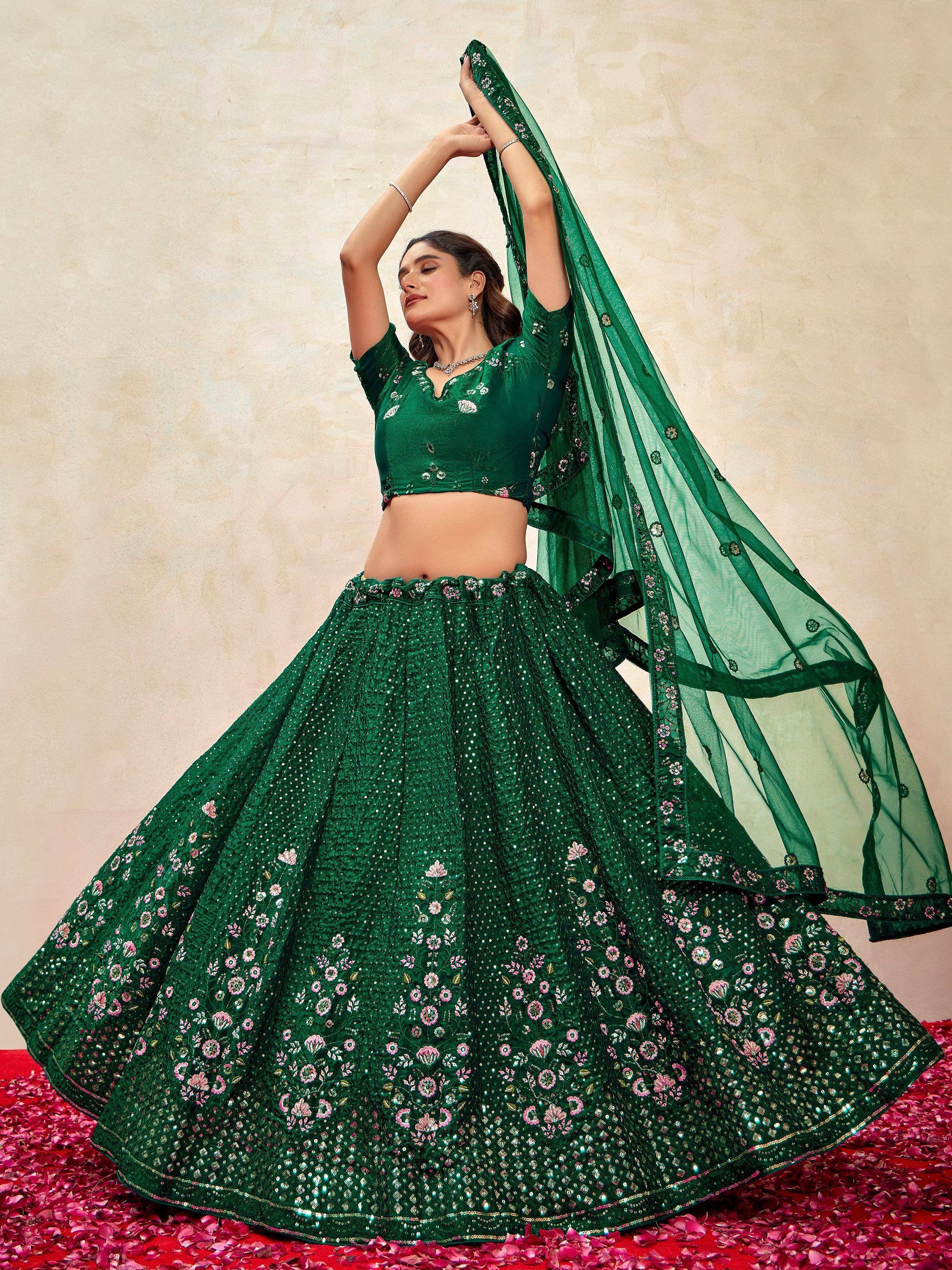 Emerald green designer lehenga choli with floral embroidery and sequins, perfect for Indian ethnic wear occasions