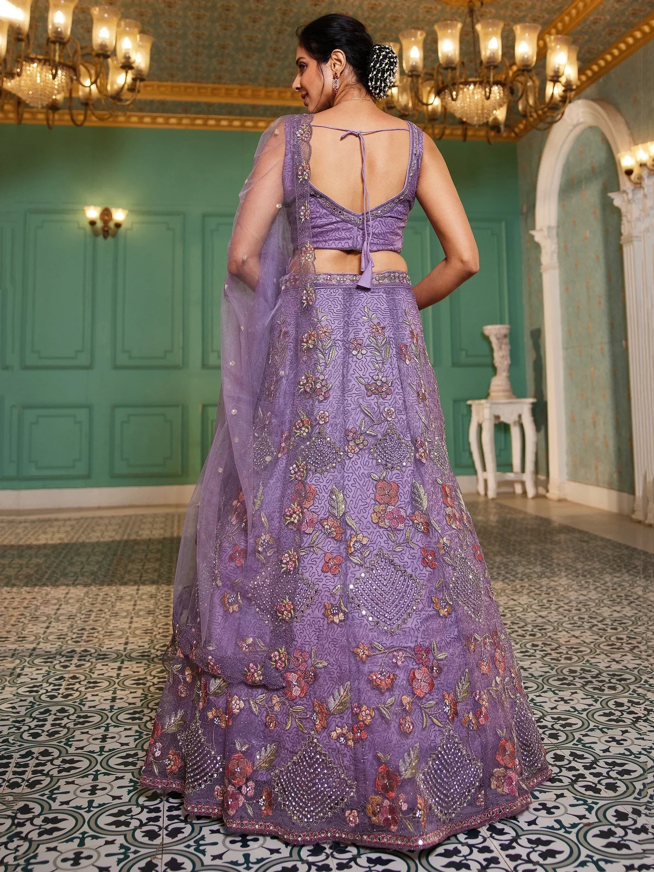 Purple floral embroidered lehenga choli with back tie blouse, perfect for Indian weddings and festive occasions.