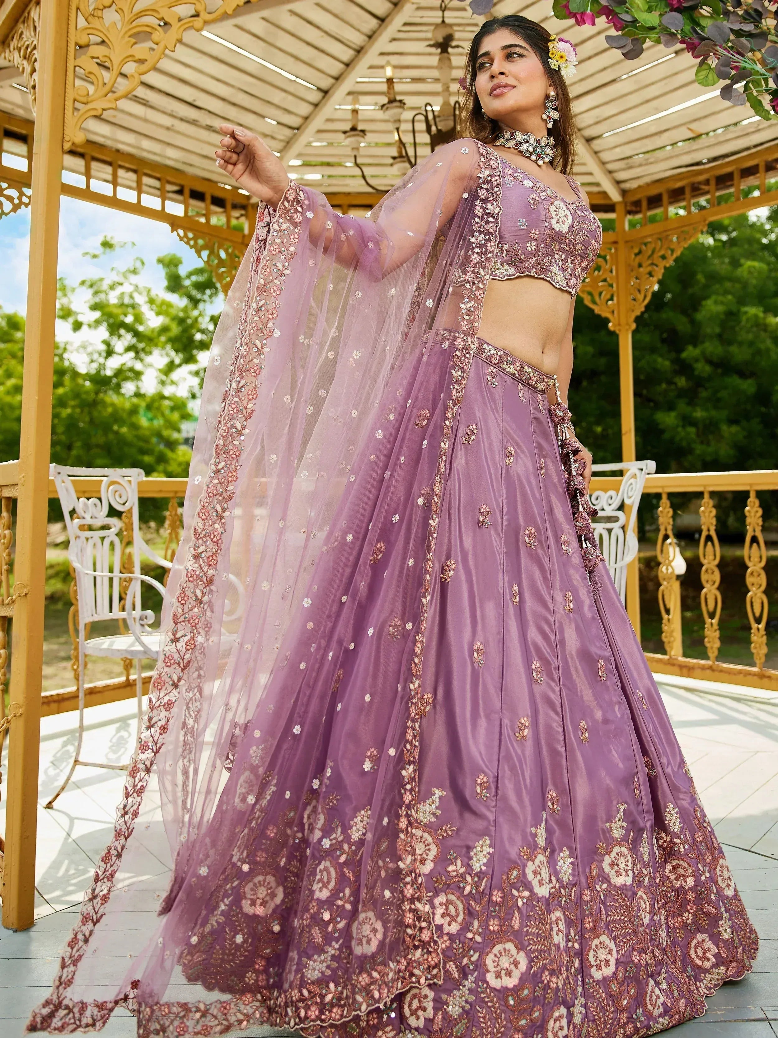 Elegant lavender lehenga choli with floral embroidery, perfect for Indian weddings and festive occasions.