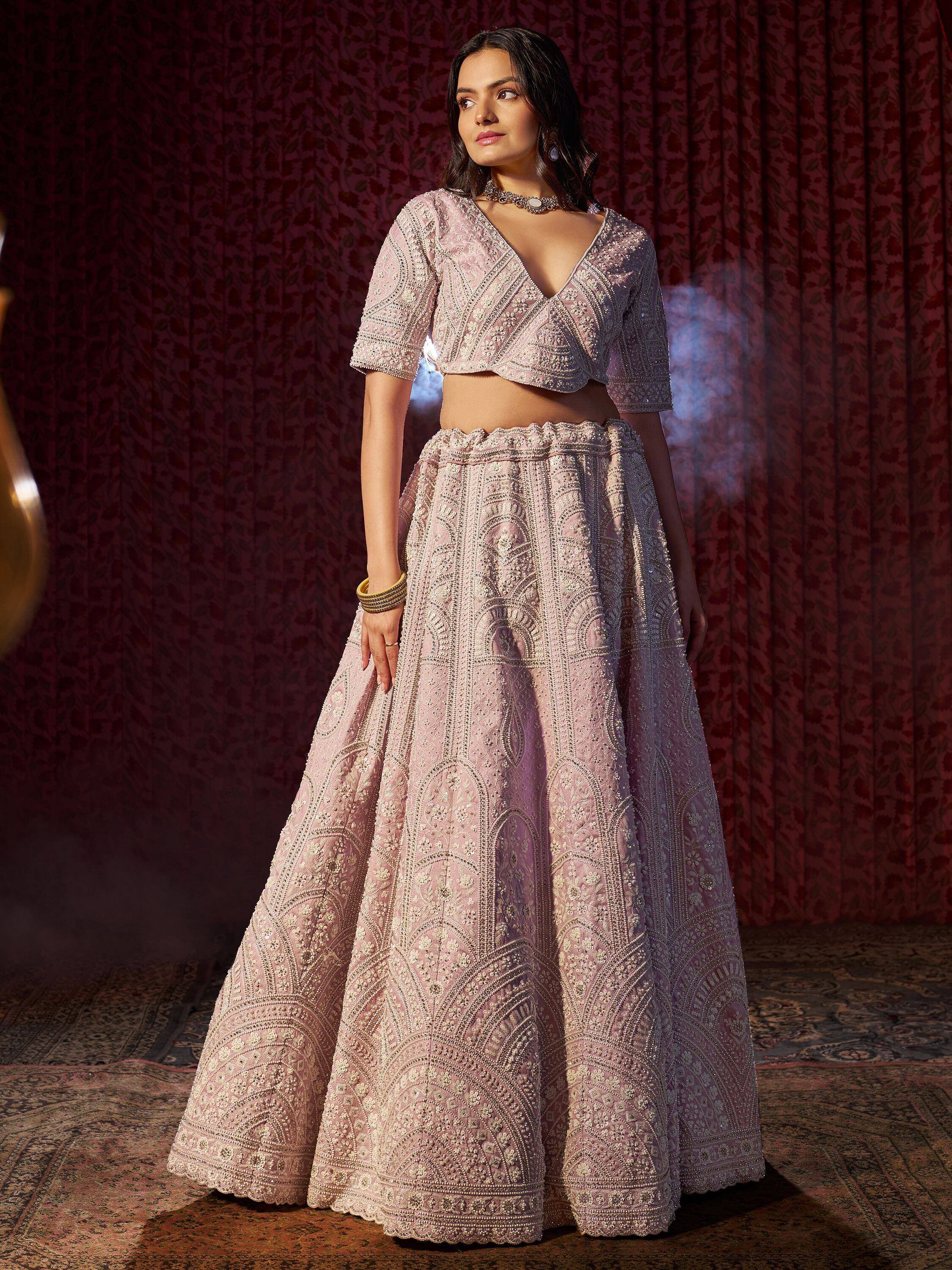 Pink embroidered lehenga choli with intricate beadwork, perfect for Indian weddings and festive occasions
