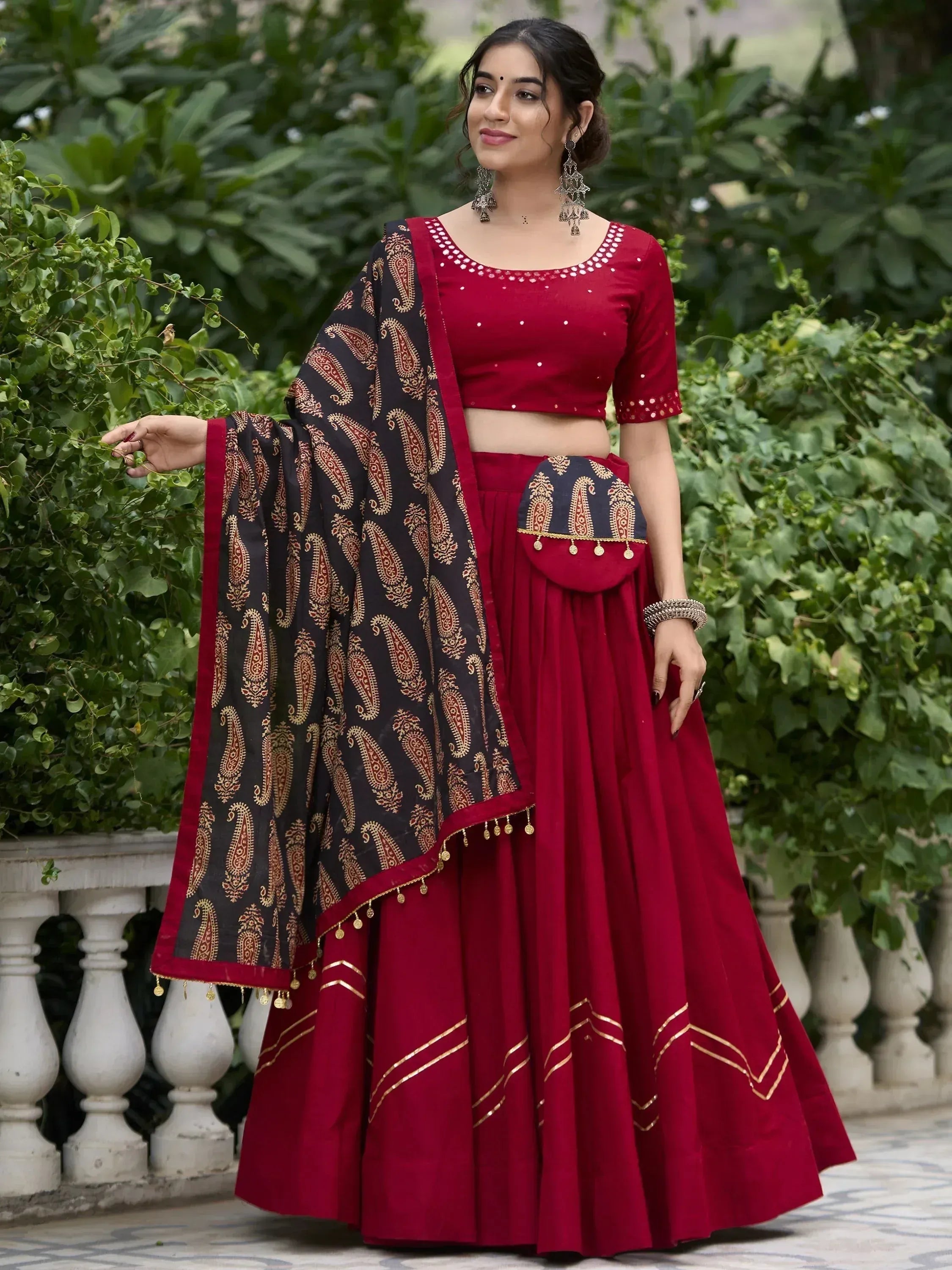 Red lehenga choli with black paisley dupatta, ethnic Indian wear for weddings and festivals