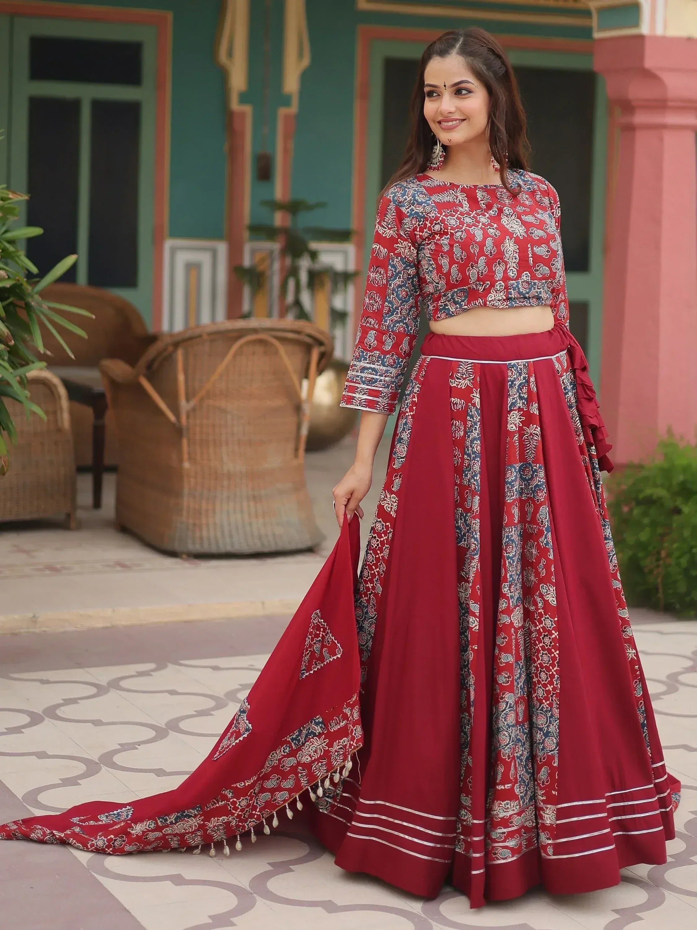 Red printed lehenga choli with ruffle skirt and dupatta, ethnic Indian wear for women