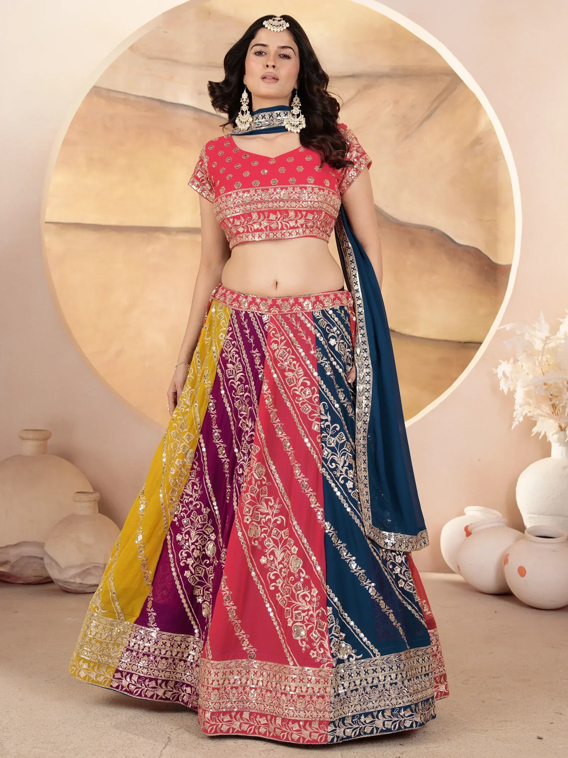 Colorful embroidered lehenga choli with gold detailing, perfect for Indian ethnic wear occasions