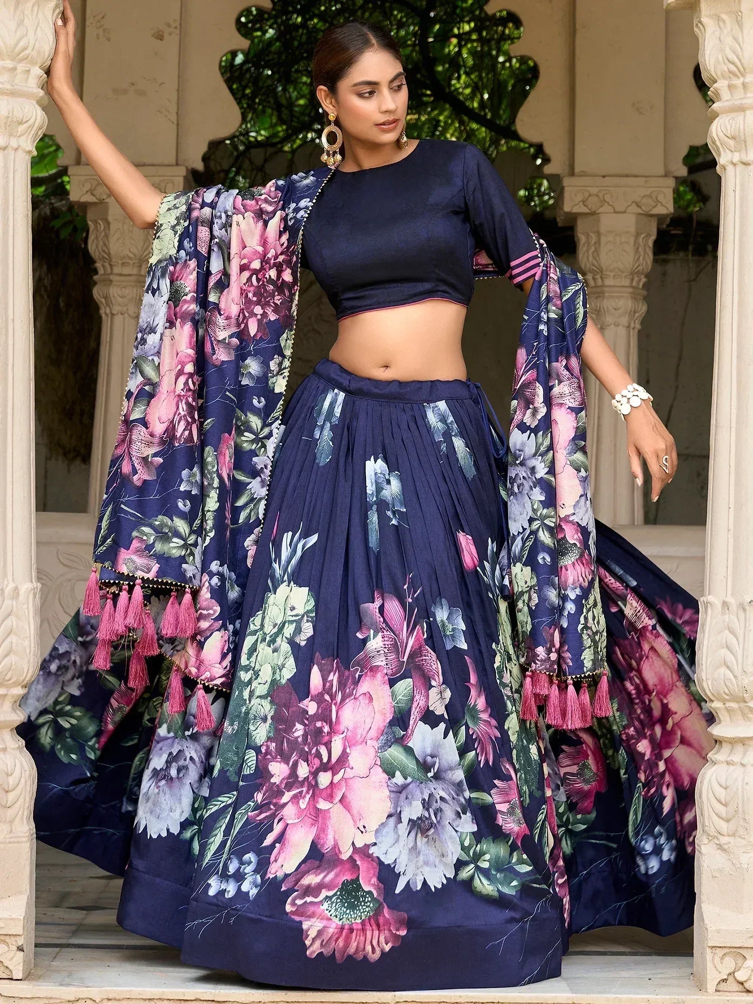 Navy blue floral lehenga choli with pink tassels, perfect for Indian ethnic wear occasions