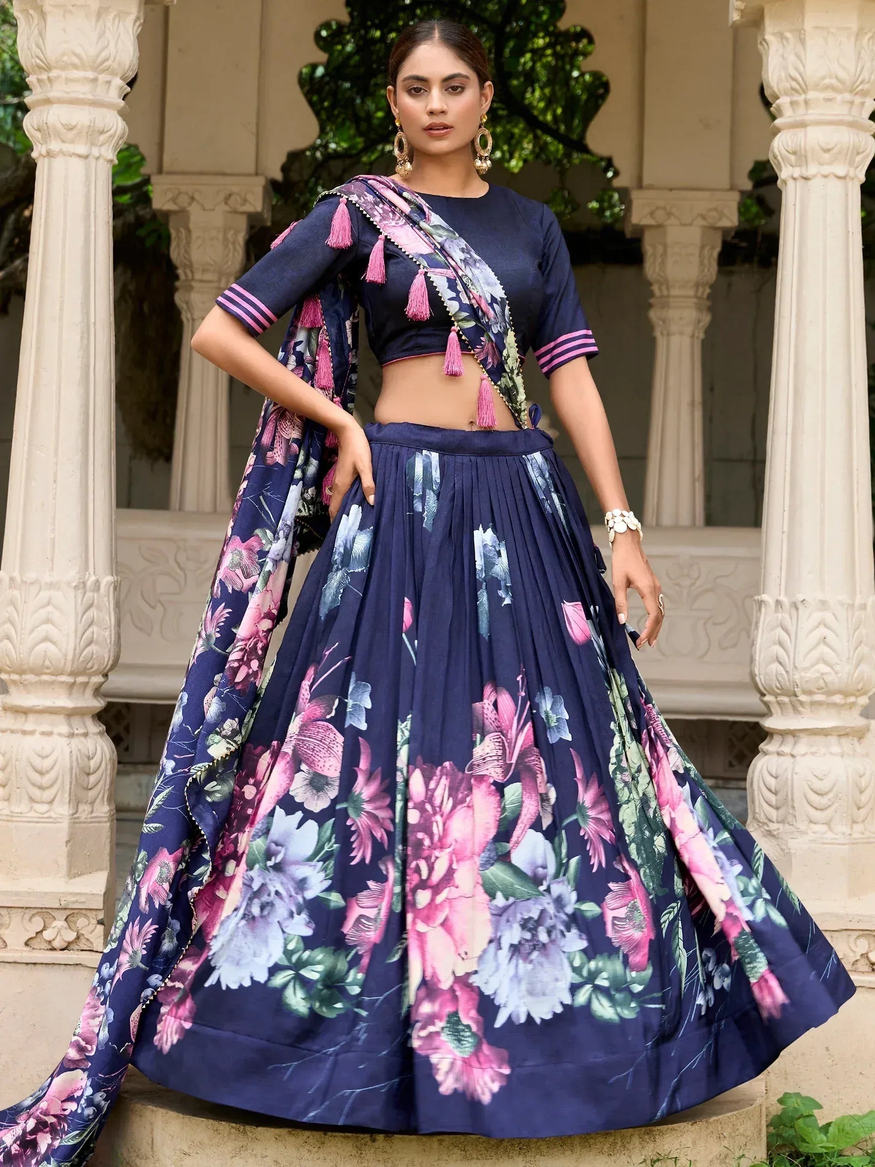 Navy blue floral lehenga choli with pink tassels, perfect for Indian ethnic wear occasions