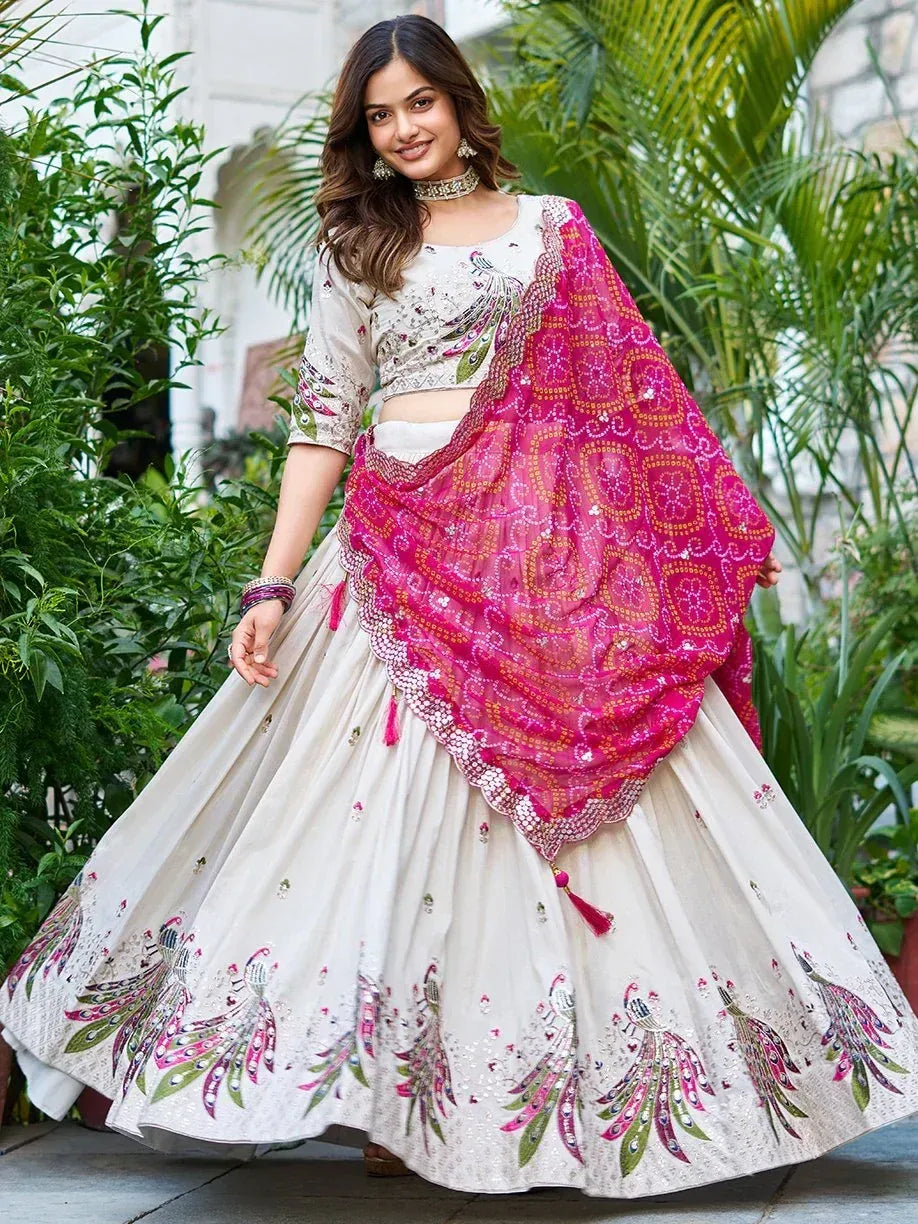 White peacock-embroidered lehenga choli with pink dupatta, perfect for Indian ethnic wear occasions