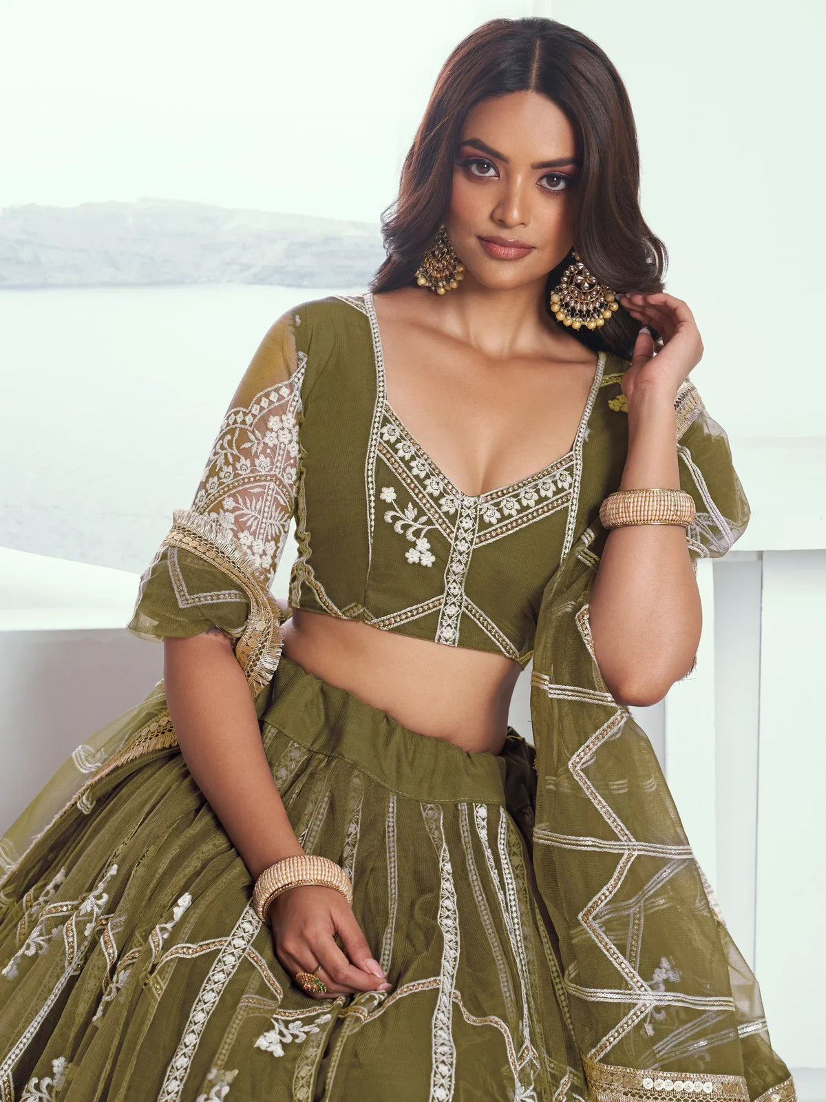 Olive green designer lehenga choli with white embroidery, perfect for Indian ethnic wear and festive occasions.