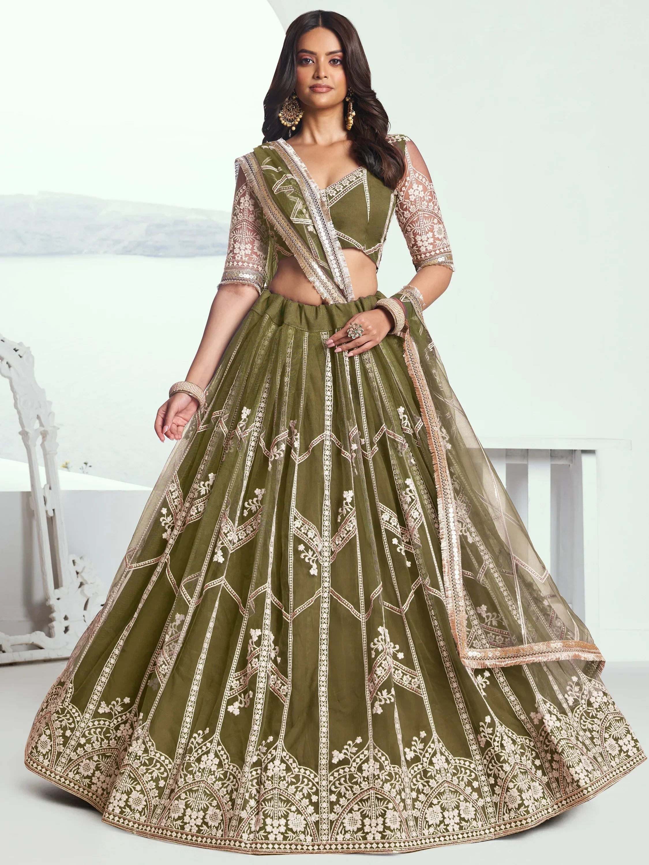 Olive green designer lehenga choli with intricate gold embroidery, perfect for Indian ethnic wear occasions.