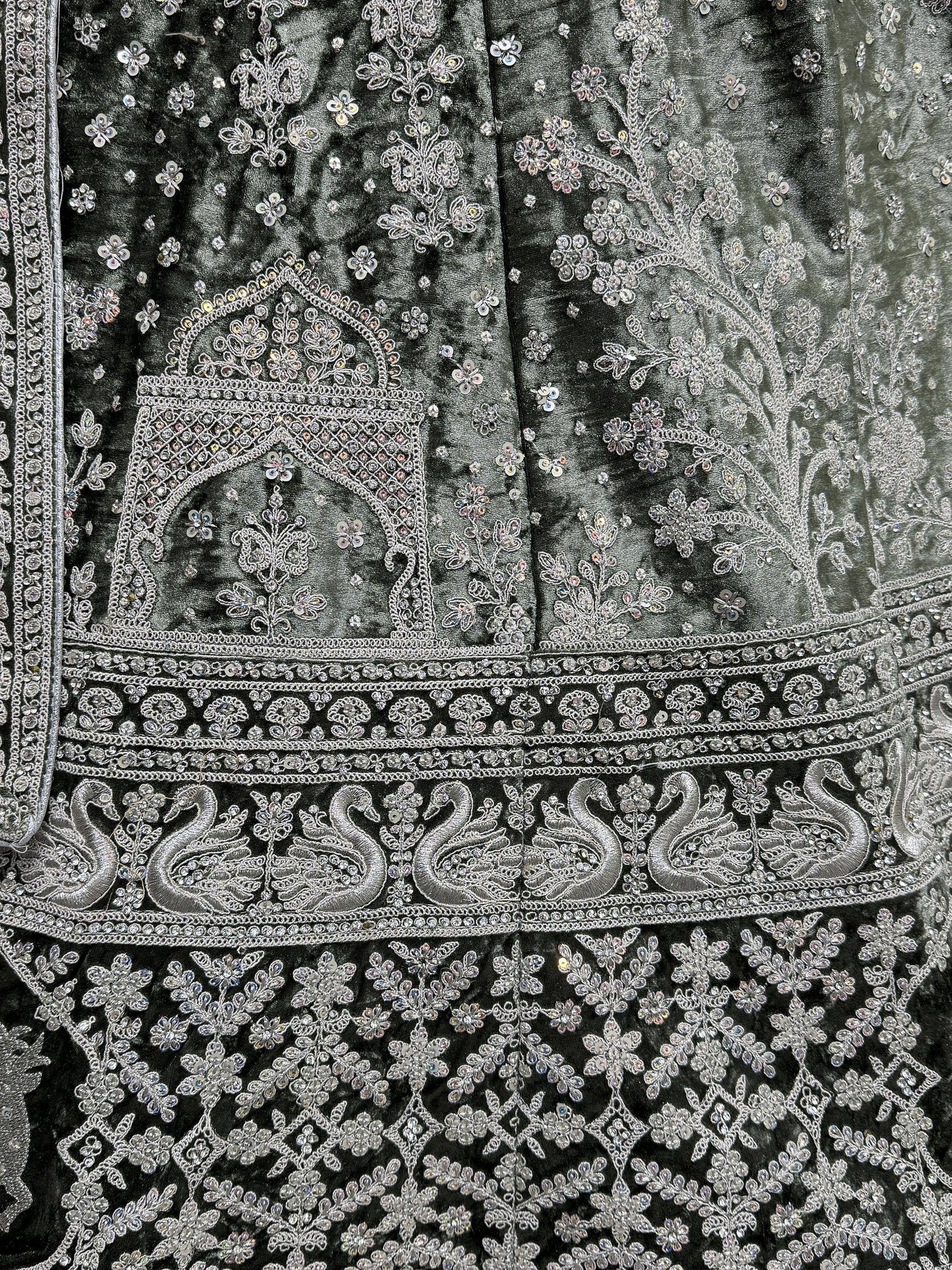 Dark green velvet ethnic gown with silver swan embroidery and floral sequin detailing